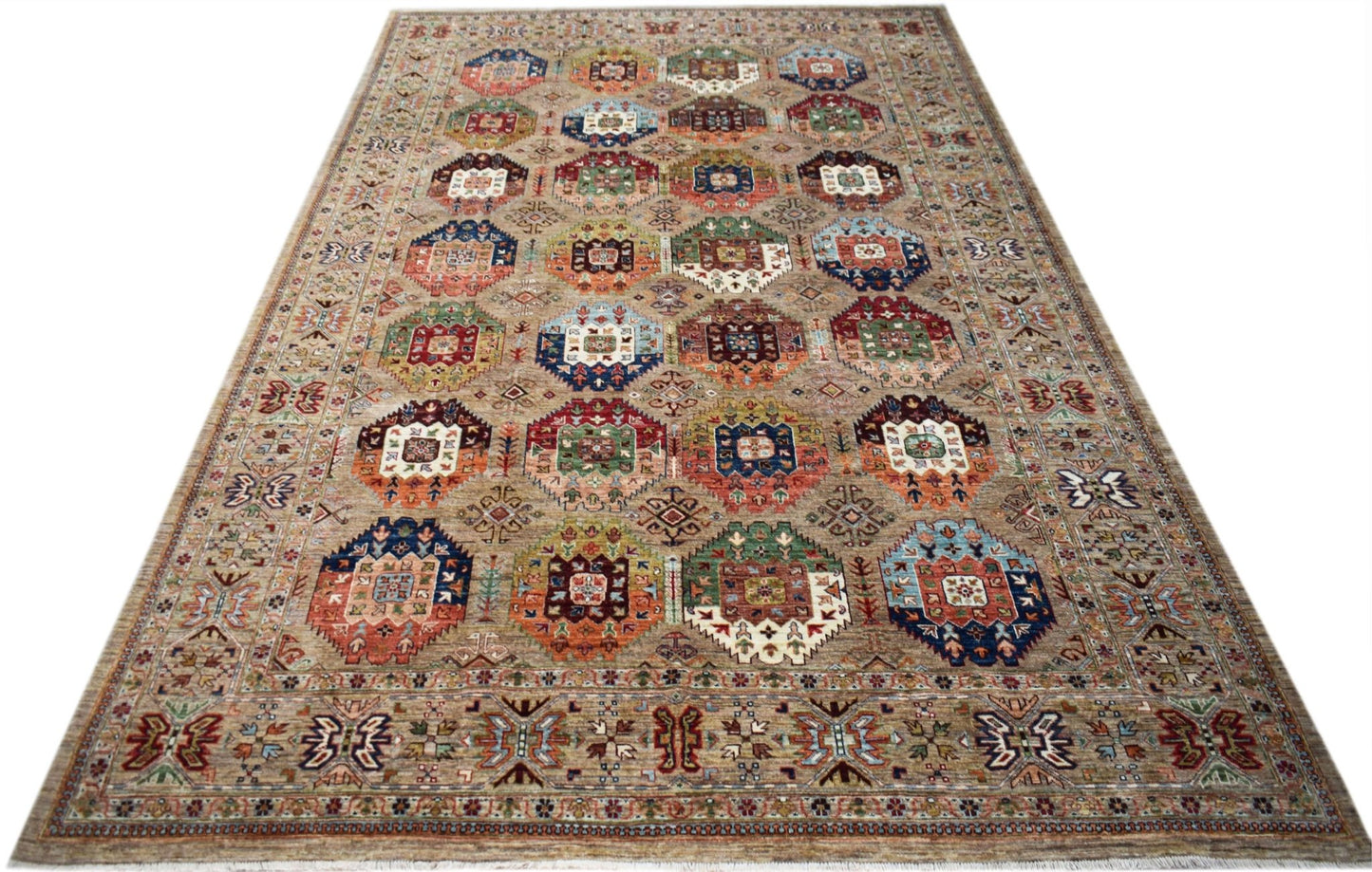 Handwoven Afghan Chobi rug featuring a repeating geometric medallion pattern in earthy tones.