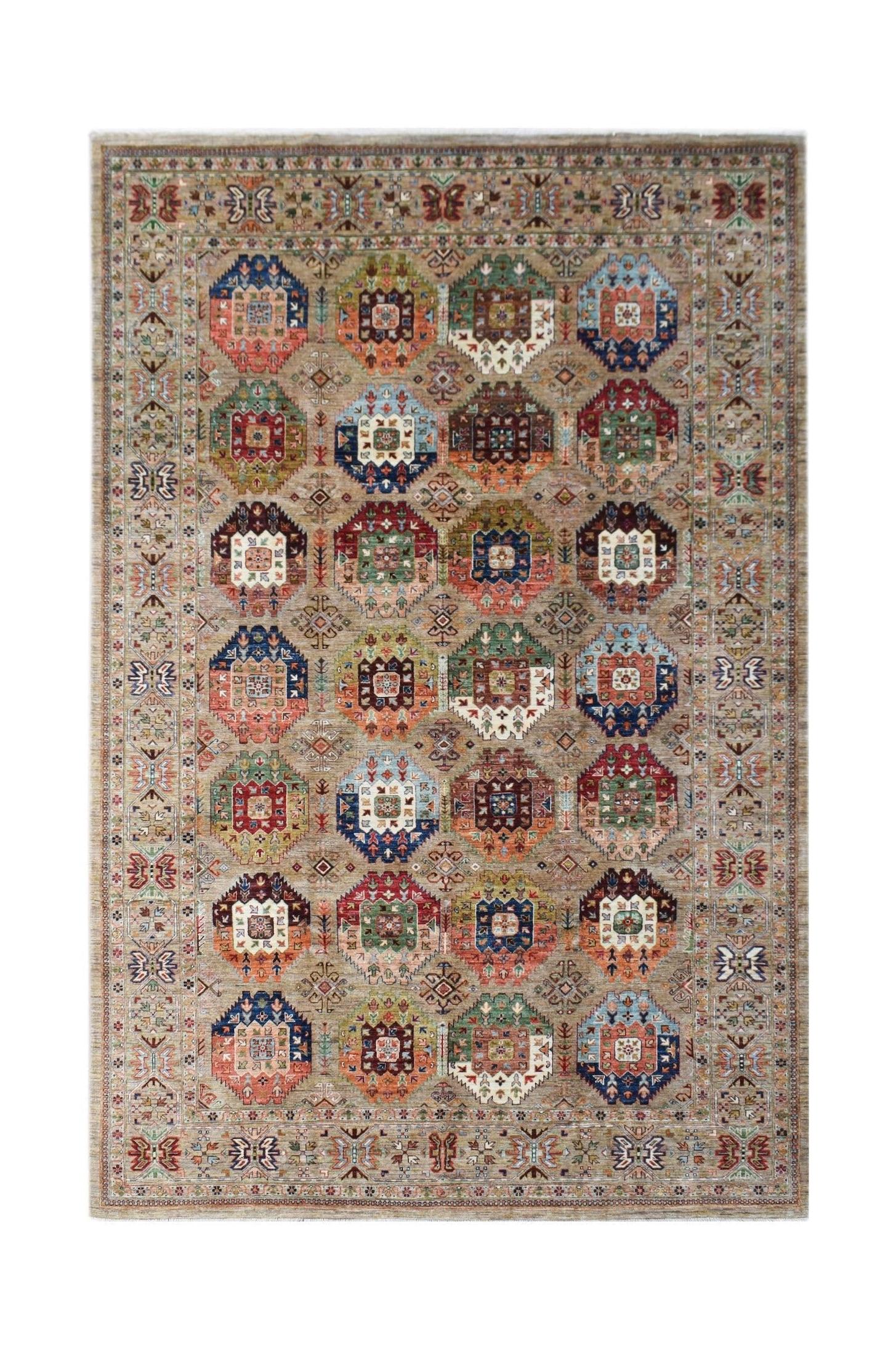 Handwoven Afghan Chobi rug featuring a repeating geometric medallion pattern in earthy tones.