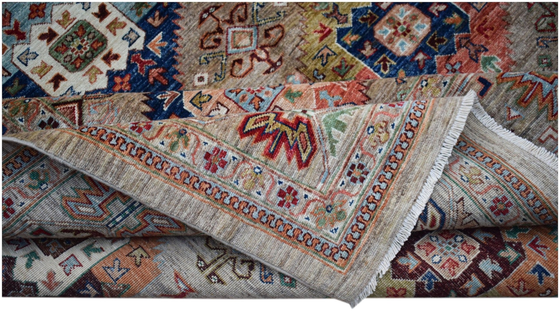 A handwoven Afghan Chobi rug featuring intricate geometric patterns in earthy, muted tones.