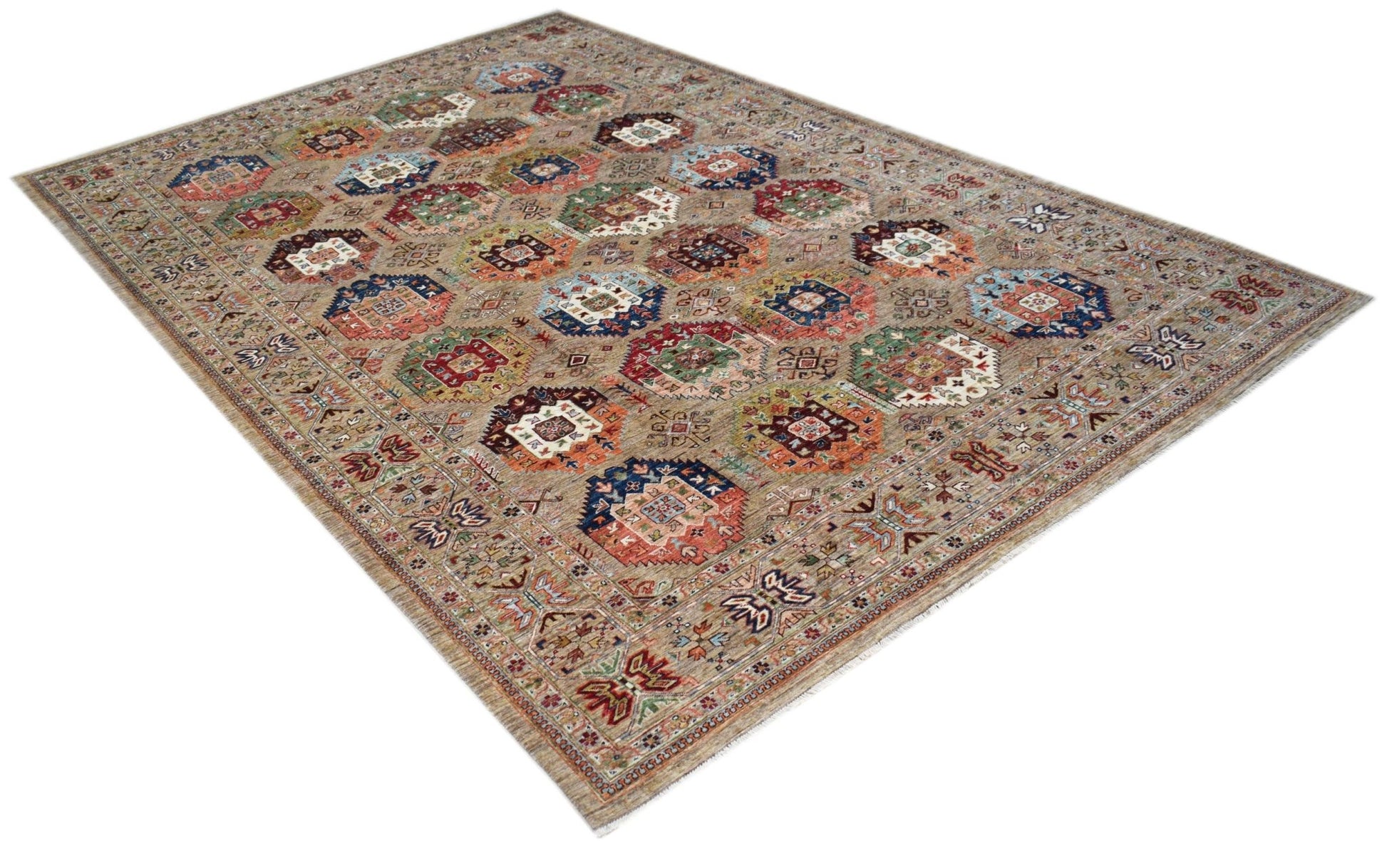 A rectangular Afghan Chobi rug featuring a repeating geometric medallion pattern in earthy tones.