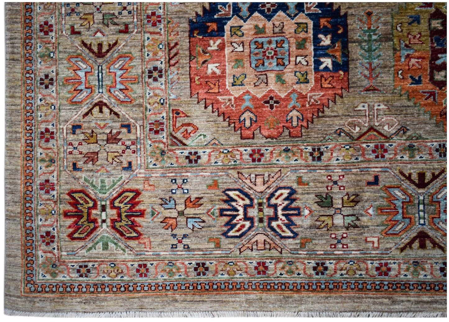 Handwoven Afghan Chobi rug featuring intricate geometric patterns in earthy, muted tones.