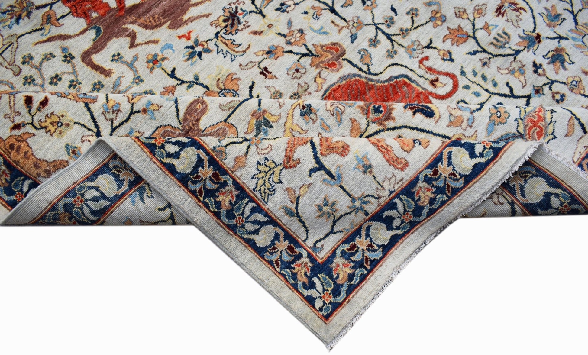 Handwoven Afghan Chobi rug featuring a traditional hunting scene with a blue floral border.
