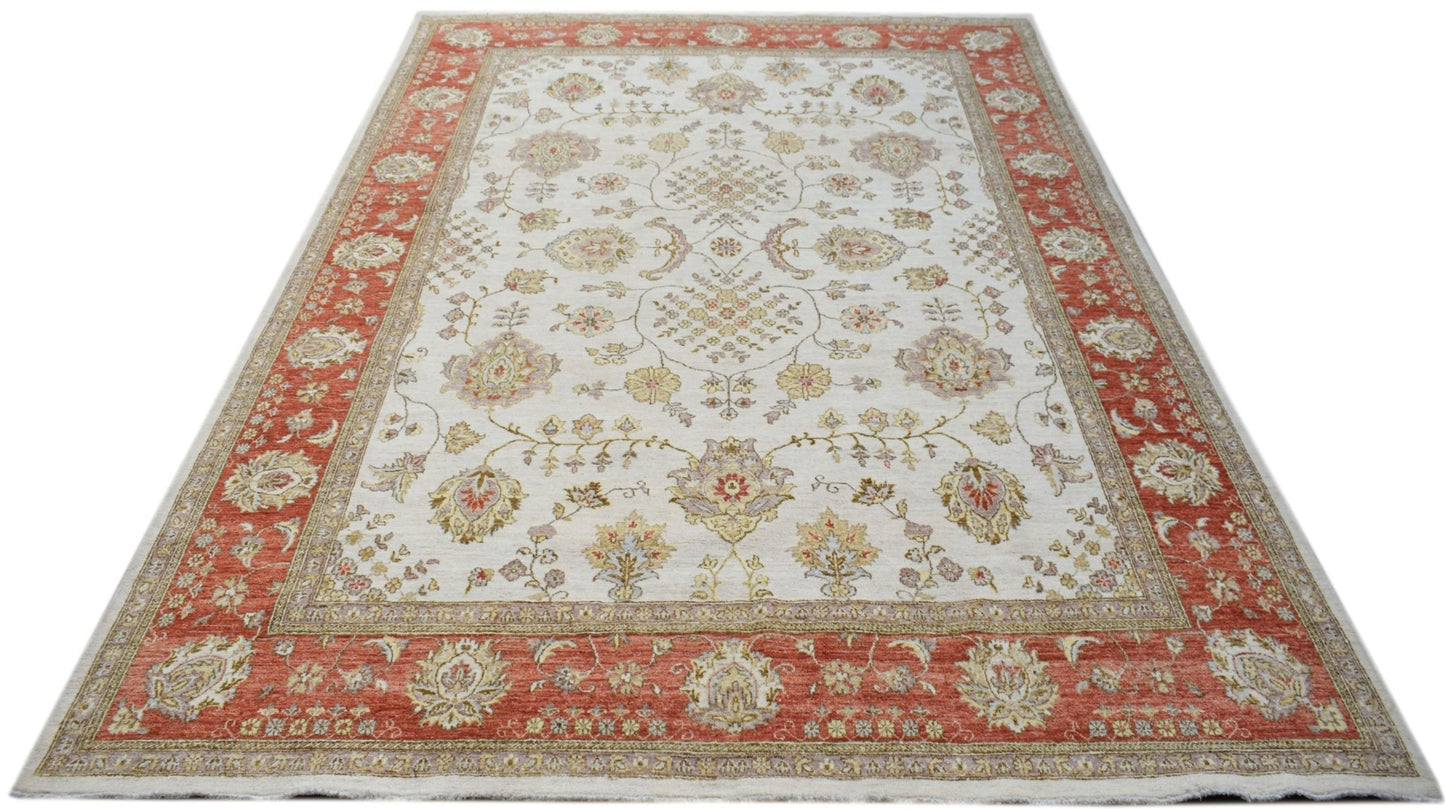 A rectangular Afghan Chobi rug featuring a traditional floral pattern in muted earth tones.