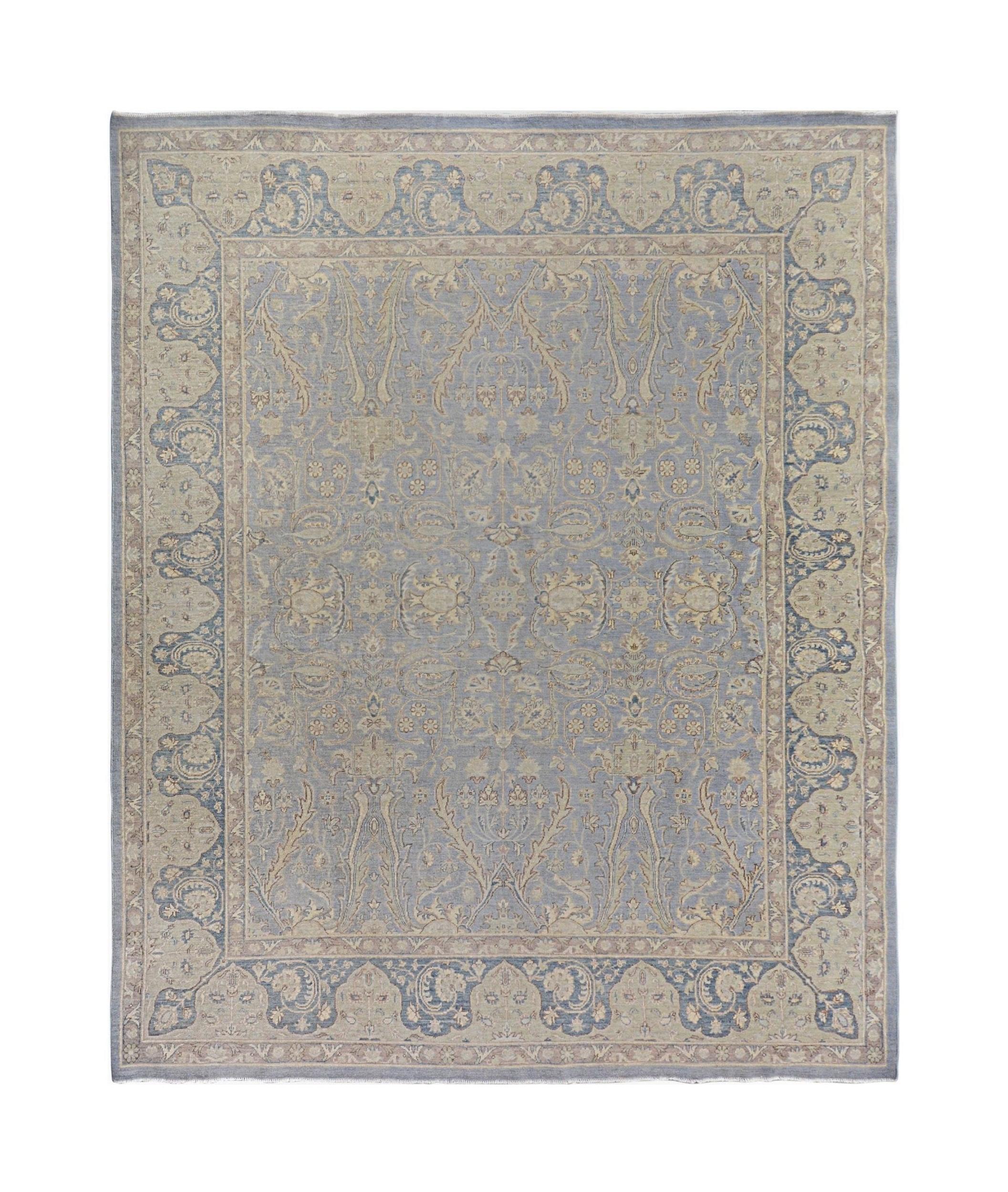Handmade Afghan Chobi rug featuring a traditional floral pattern in shades of blue and beige.