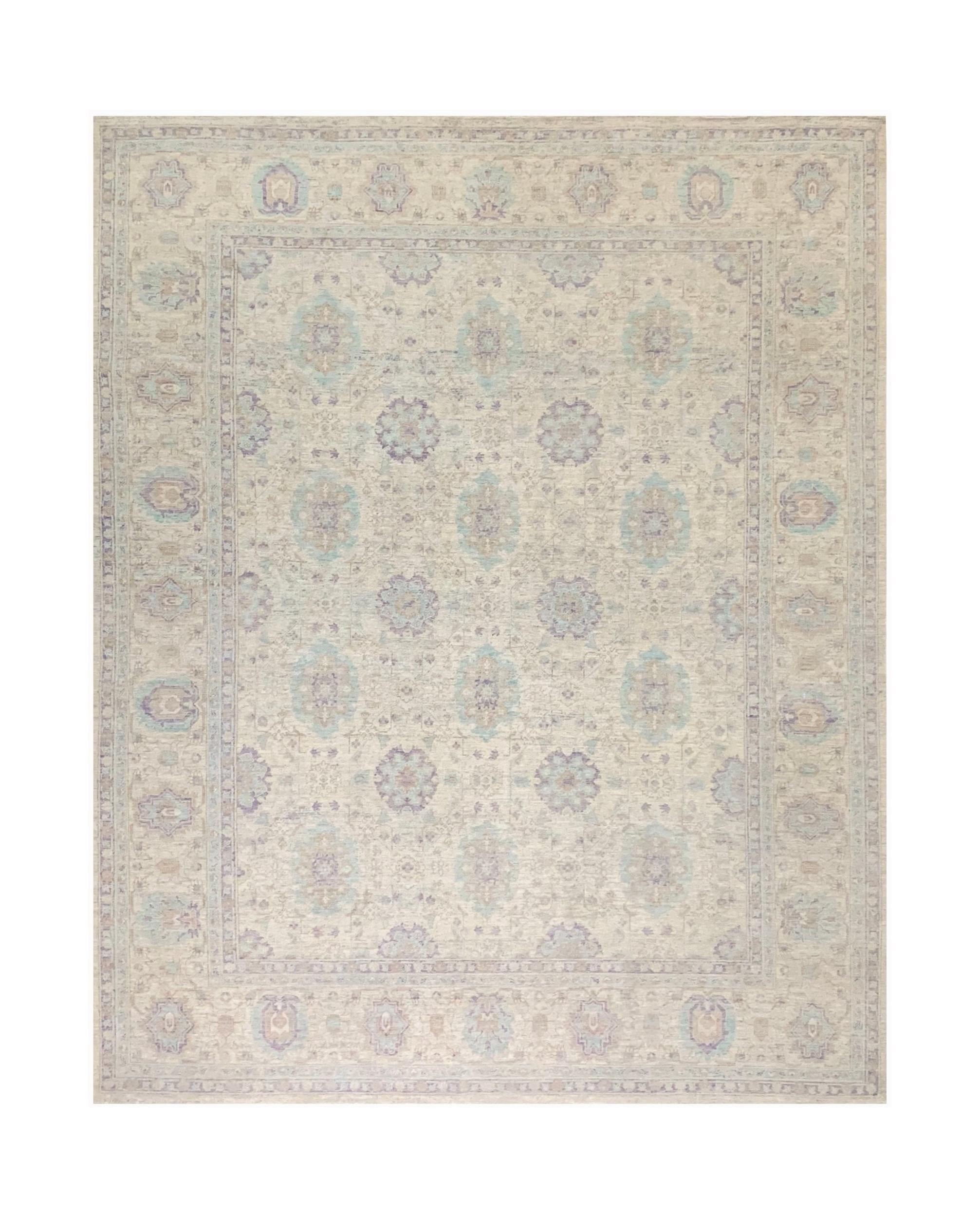 A handmade Afghan Chobi rug featuring a traditional floral pattern in soft beige and blue tones.