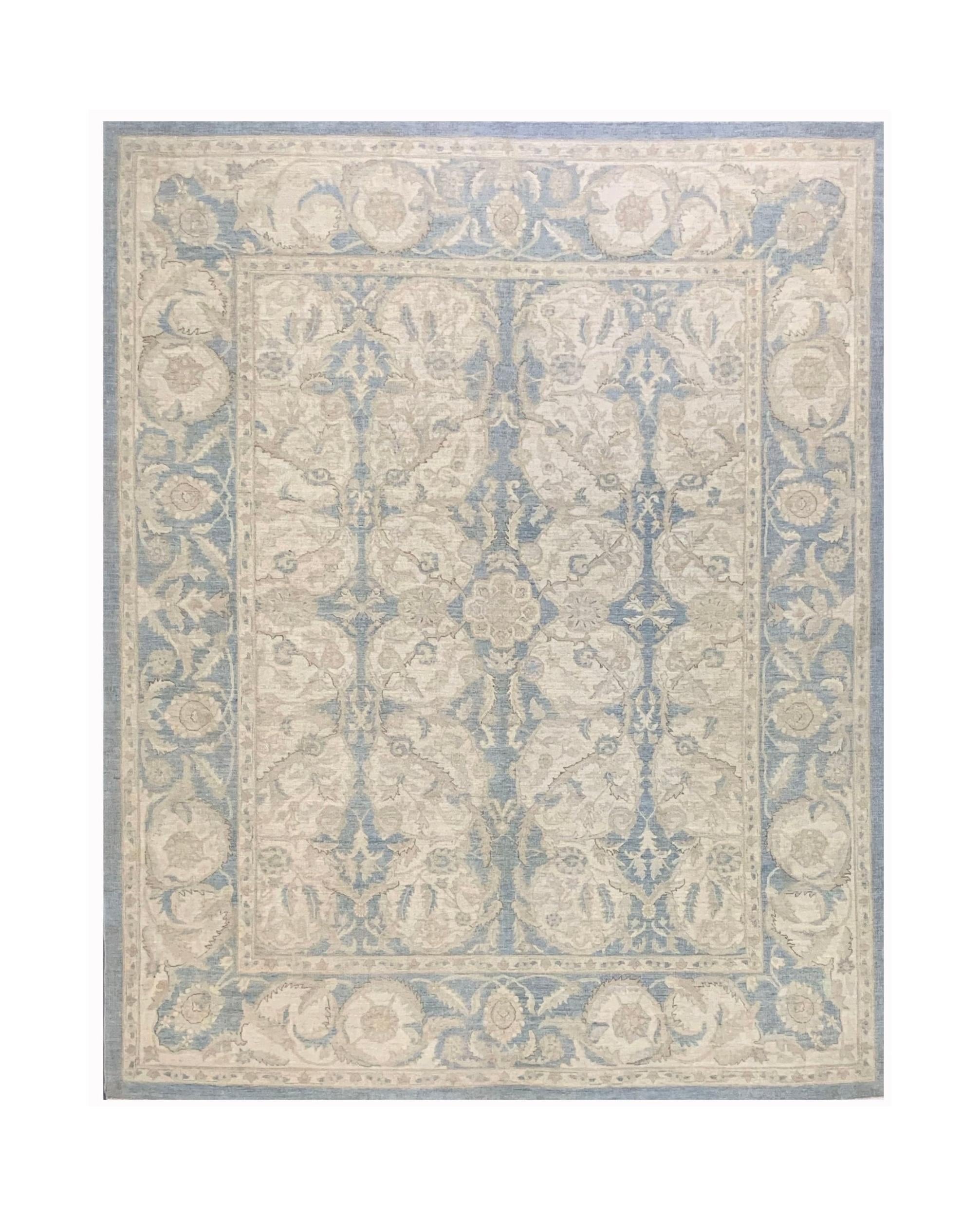 A handmade Afghan Chobi rug featuring a traditional floral pattern in soft blue and beige tones.