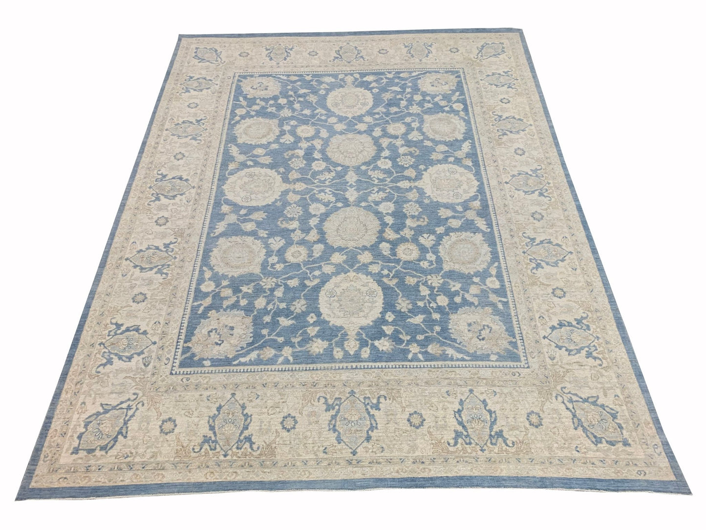 A rectangular Afghan Chobi rug featuring a traditional floral pattern in blue and beige tones.