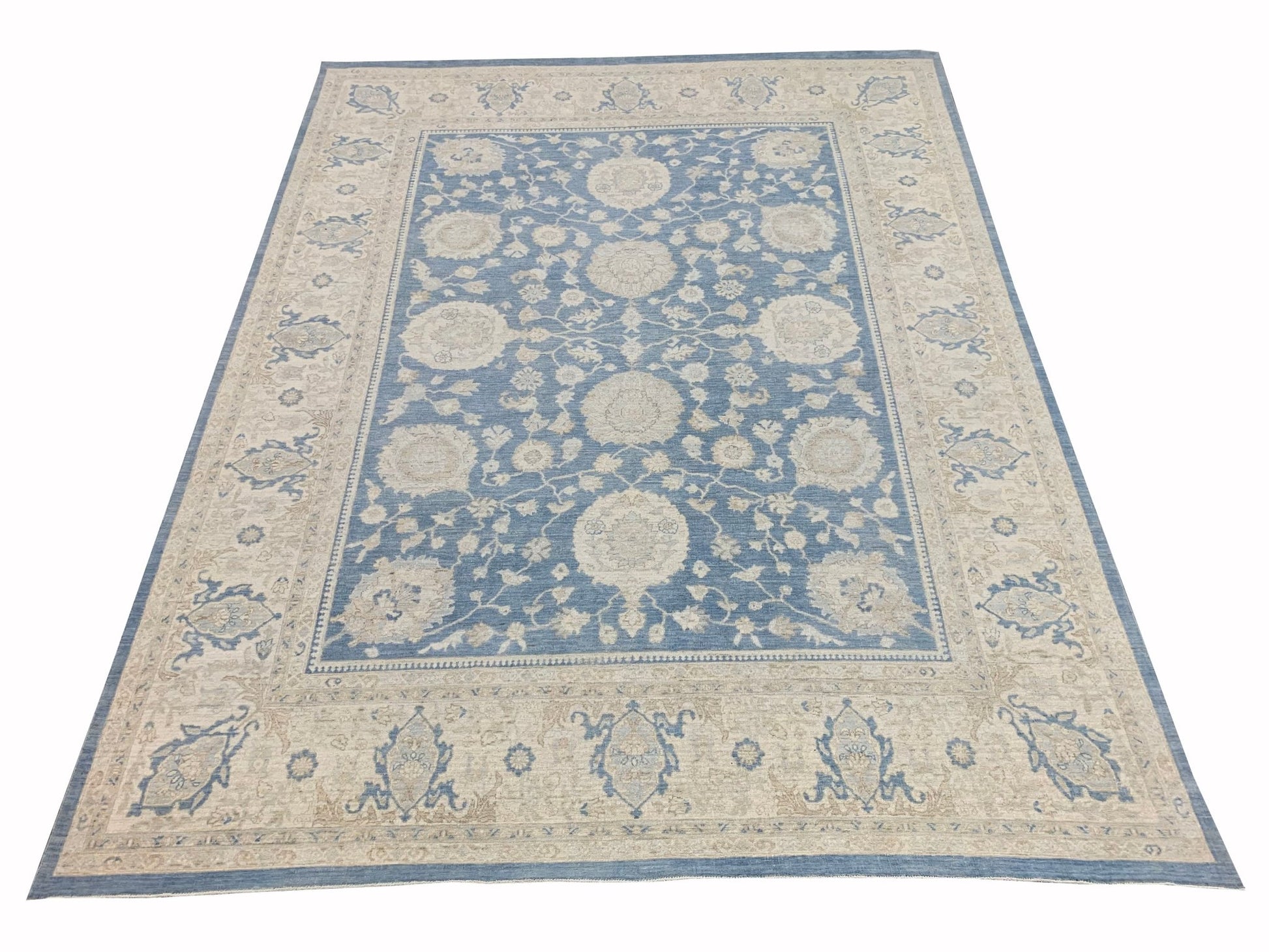 A rectangular Afghan Chobi rug featuring a traditional floral pattern in blue and beige tones.