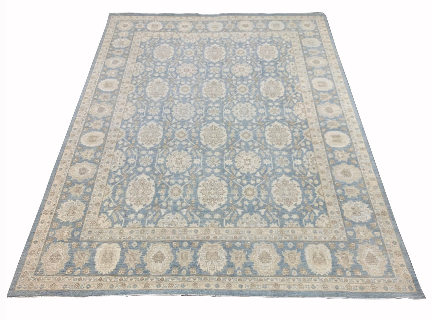 A handmade Afghan Chobi rug featuring a traditional floral pattern in shades of blue and beige.
