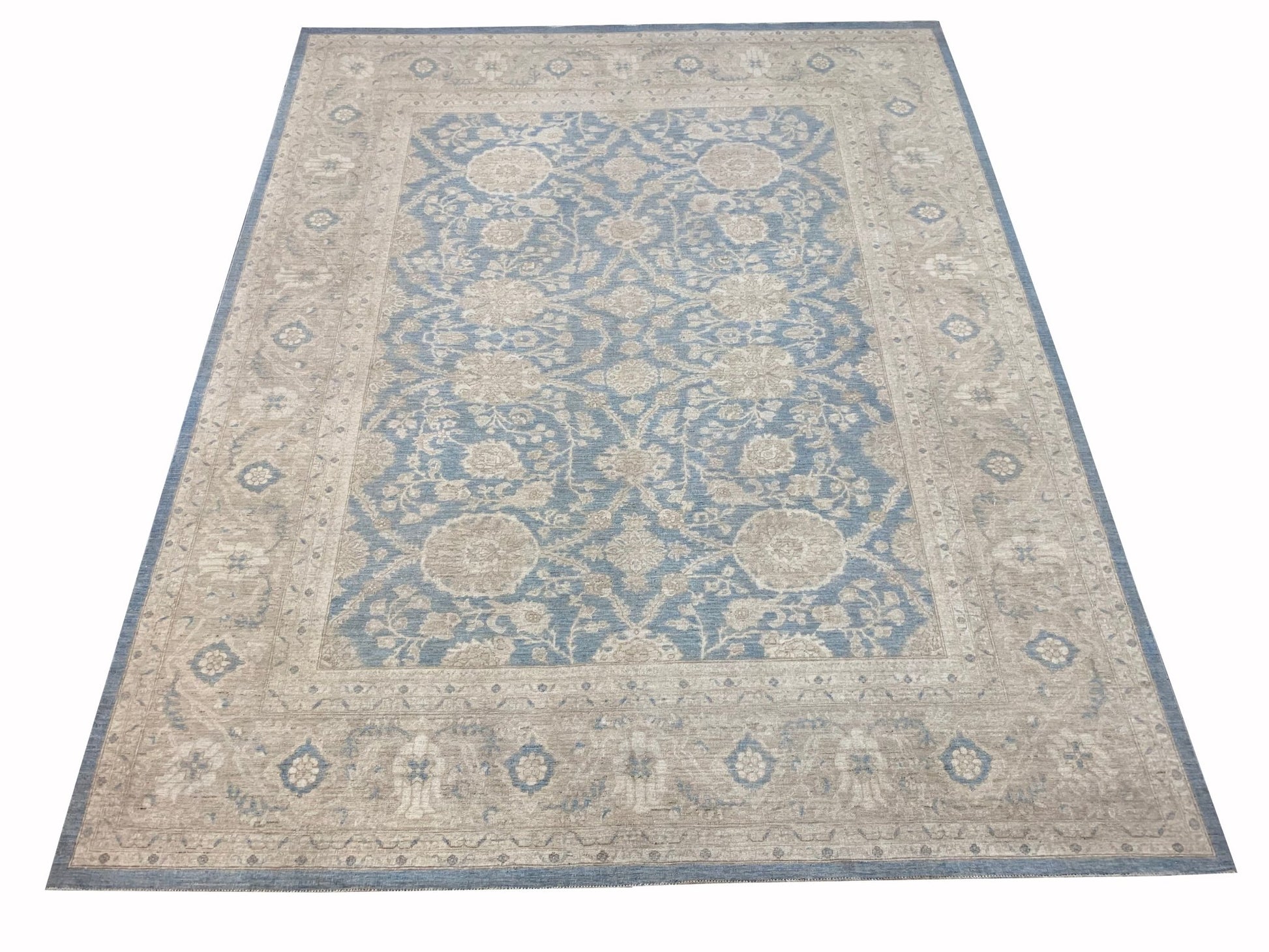A rectangular Afghan Chobi rug featuring a traditional floral pattern in shades of blue and beige.