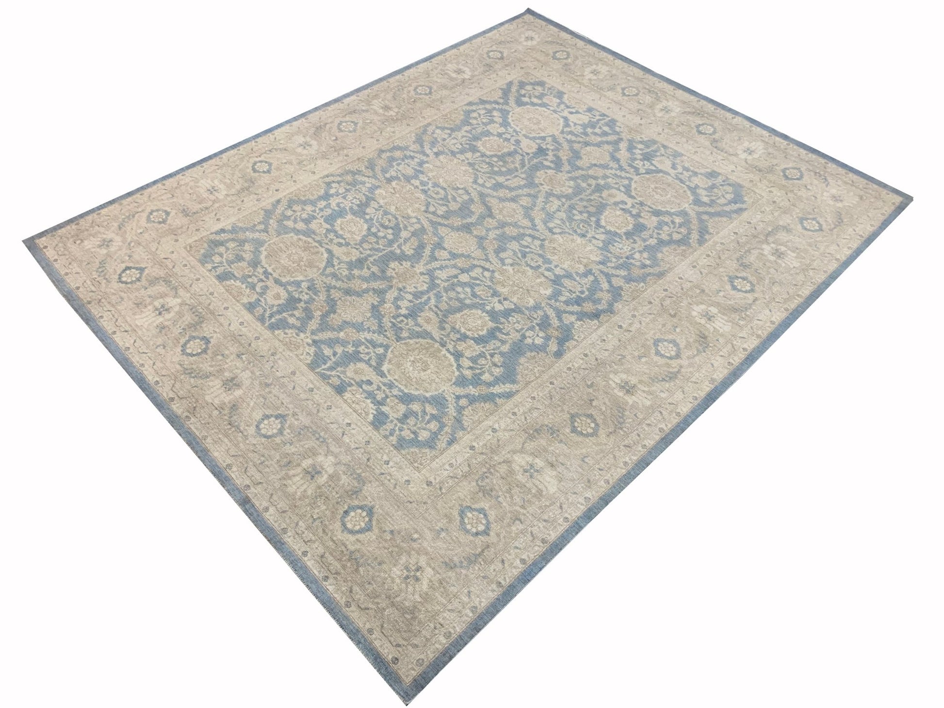 An Afghan Chobi rug featuring a traditional floral pattern in shades of blue and beige.