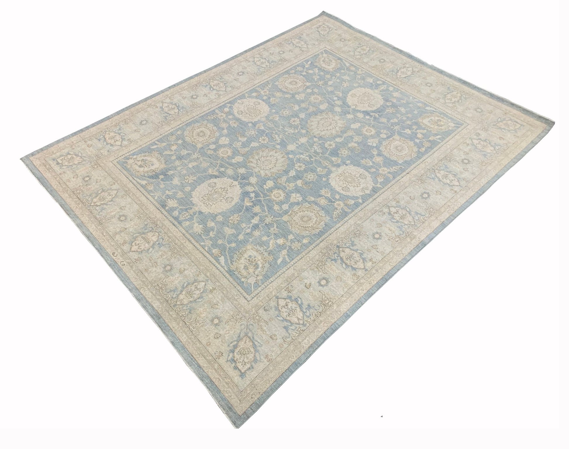 An Afghan Chobi rug featuring a traditional floral pattern in shades of blue and beige.