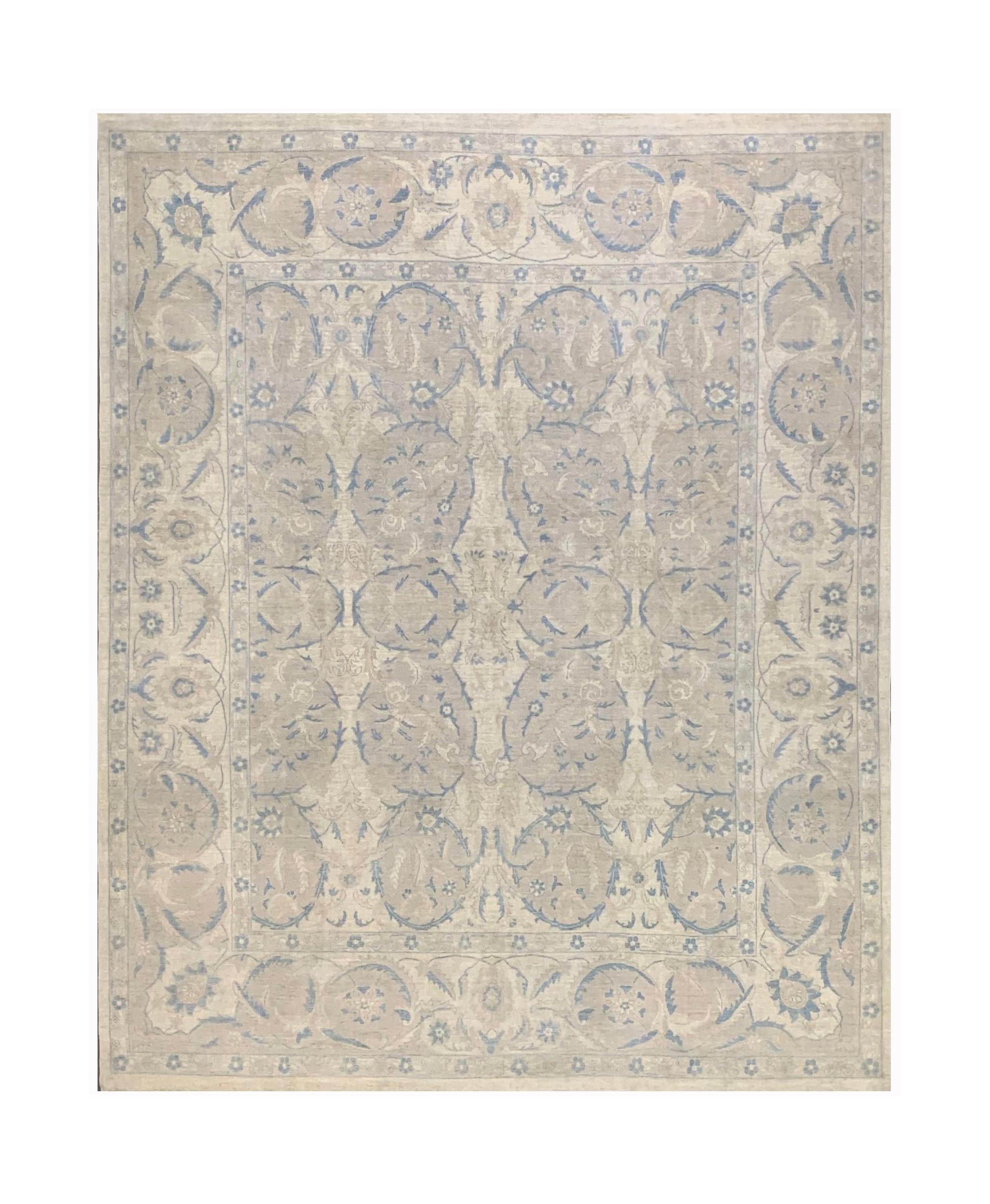 Handmade Afghan Balkh rug featuring a traditional floral pattern in soft blue and beige tones.