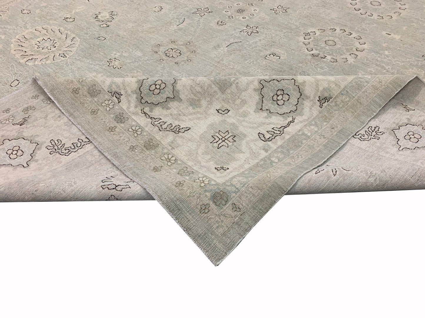 A handmade Afghan Balkh rug featuring a light grey field with traditional floral motifs.