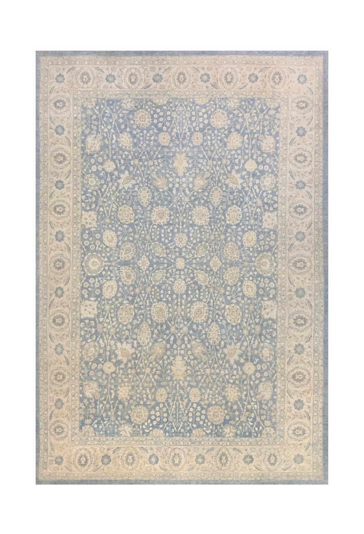 A handmade Afghan Balkh rug featuring a traditional floral pattern in blue and cream tones.