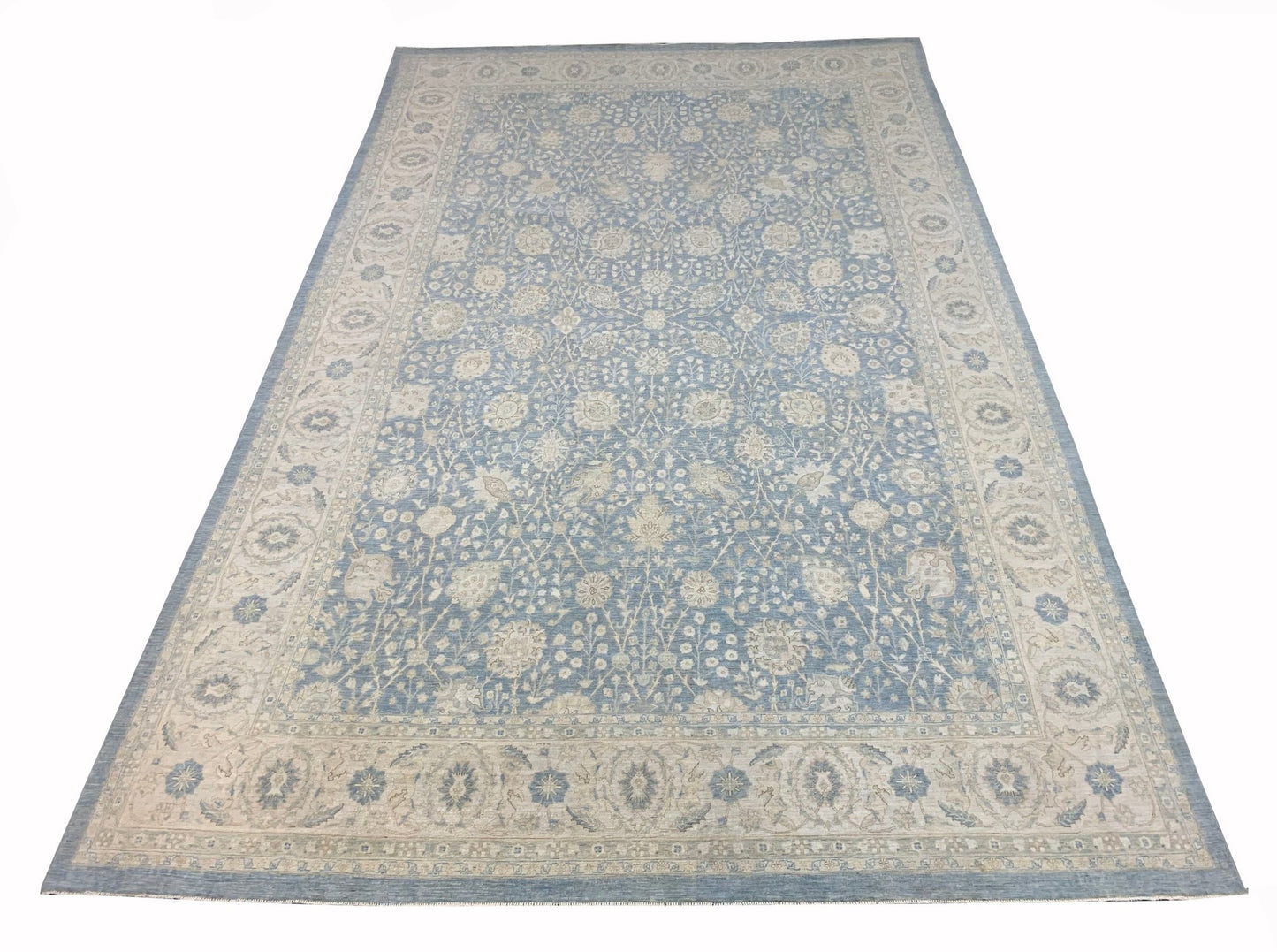 An Afghan Balkh rug featuring a traditional floral pattern in shades of blue and cream.