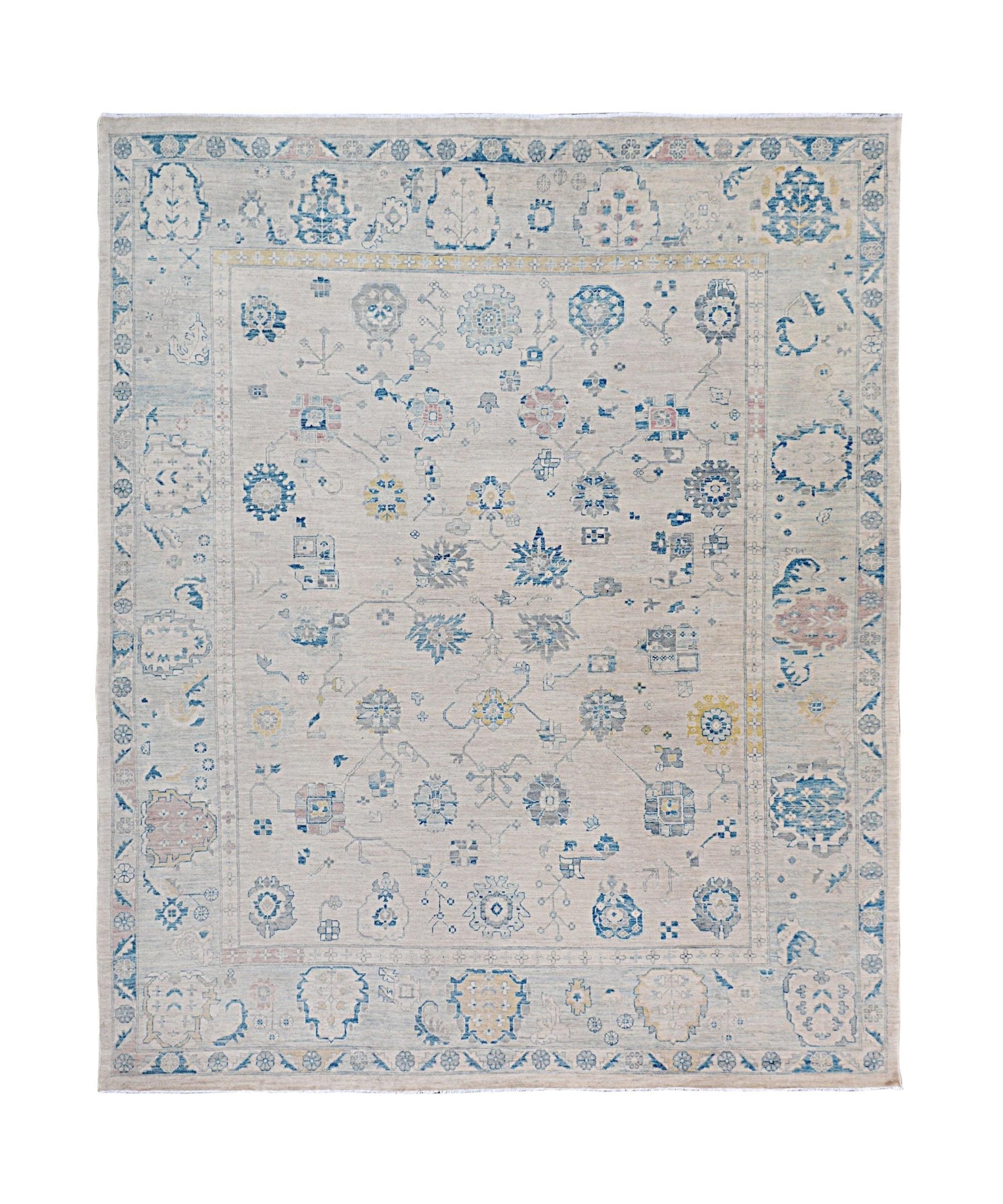 Handmade Afghan Chobi rug featuring a traditional floral pattern in blue and beige tones.