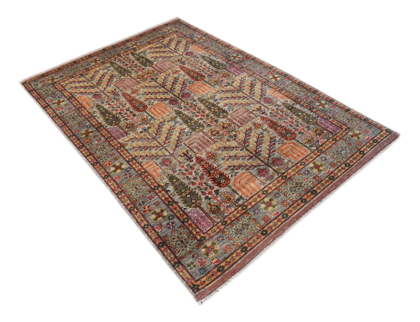 An Afghan Chobi rug featuring a traditional Tree of Life pattern in earthy, muted tones.