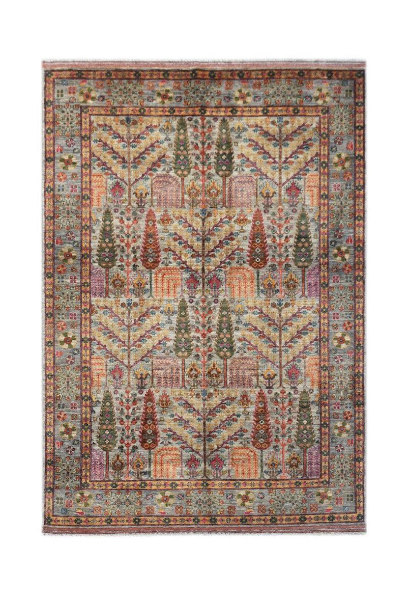 Handwoven Afghan Chobi rug featuring a traditional Tree of Life pattern in earthy tones.