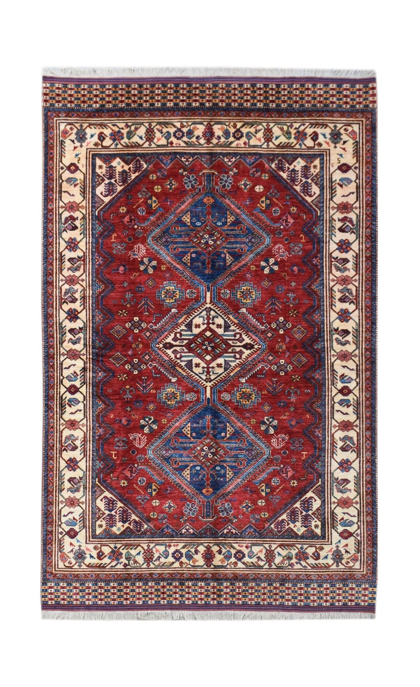 Handwoven Afghan Herati rug featuring a traditional geometric pattern in red, blue, and cream.