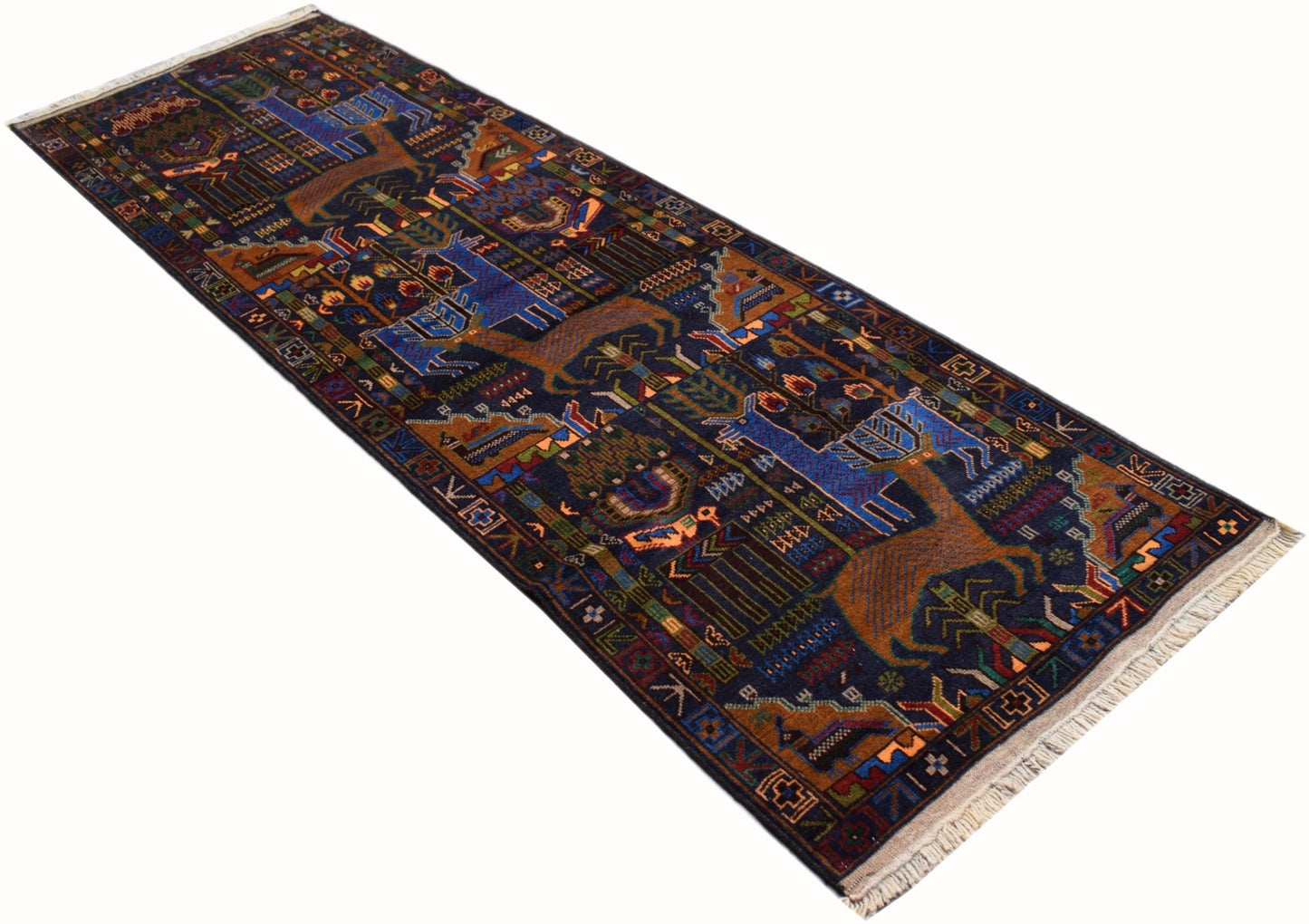 A handmade Afghan wool runner rug featuring a traditional hunting scene with deer on a dark blue background.