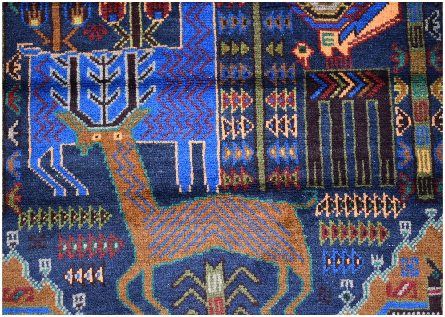 Handmade Afghan wool runner rug featuring a detailed hunting scene with stylized animal motifs.