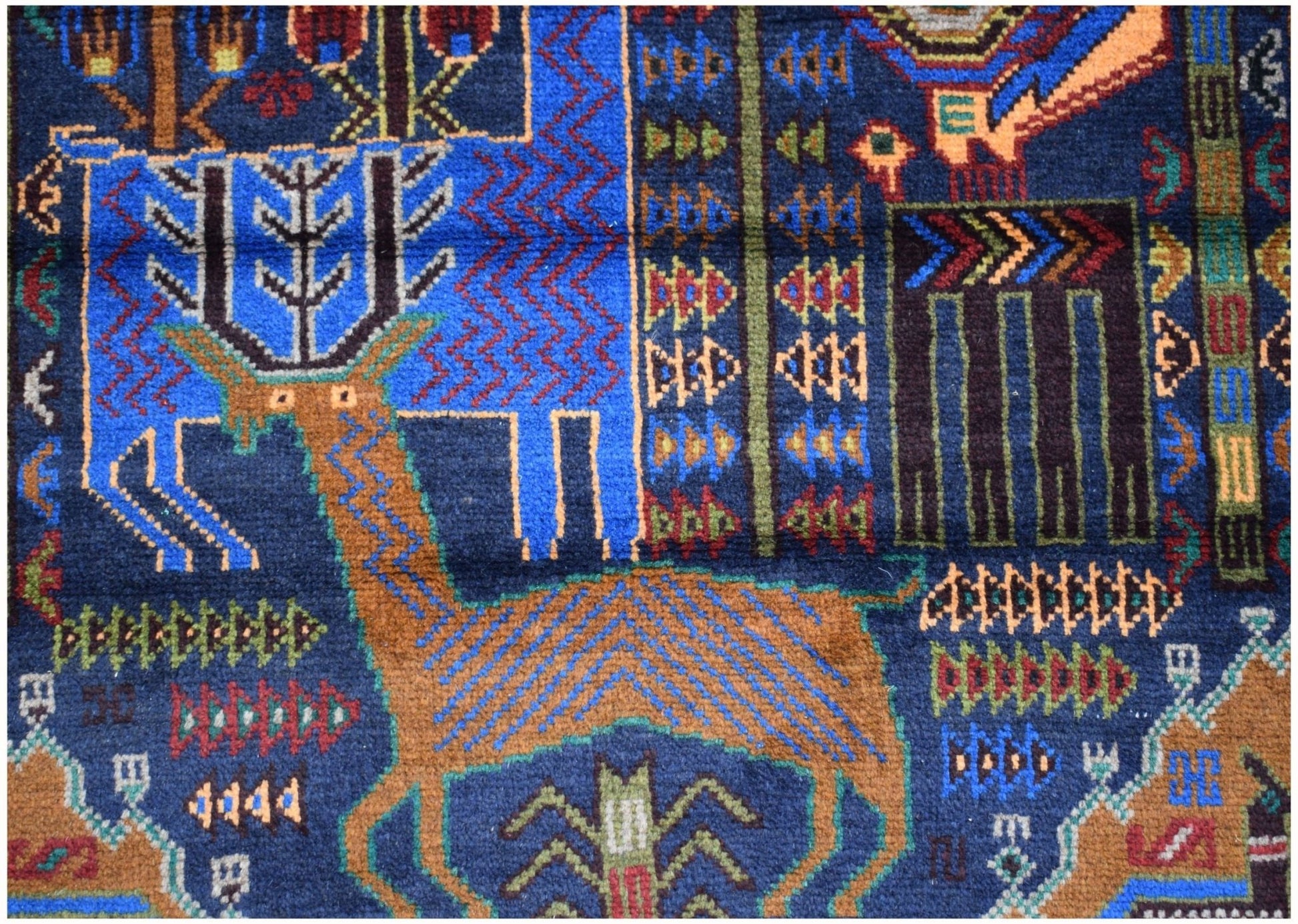 Handmade Afghan wool runner rug featuring a detailed hunting scene with stylized animal motifs.