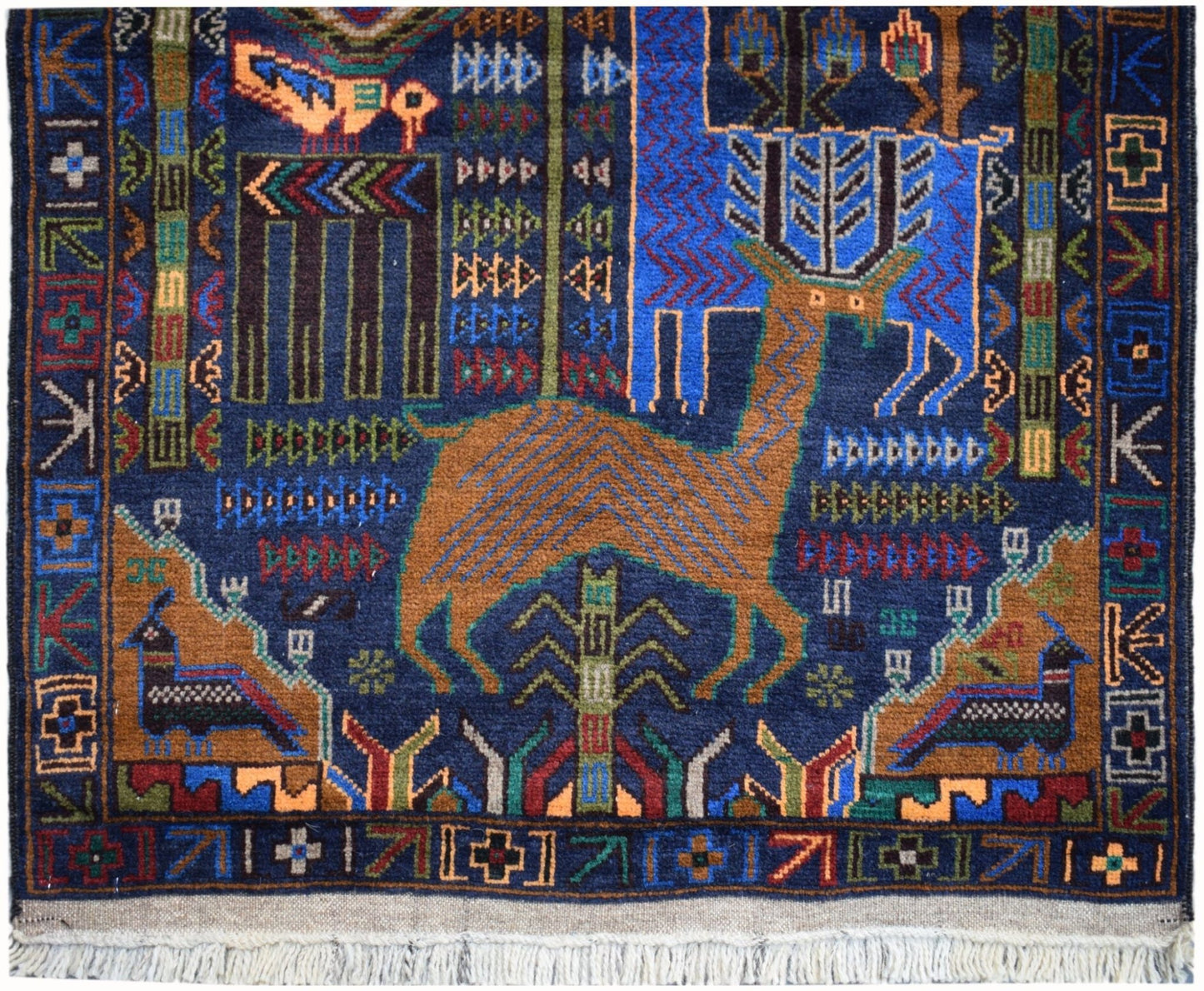 Handmade Afghan wool runner rug featuring a blue background with a central deer and hunting motifs.