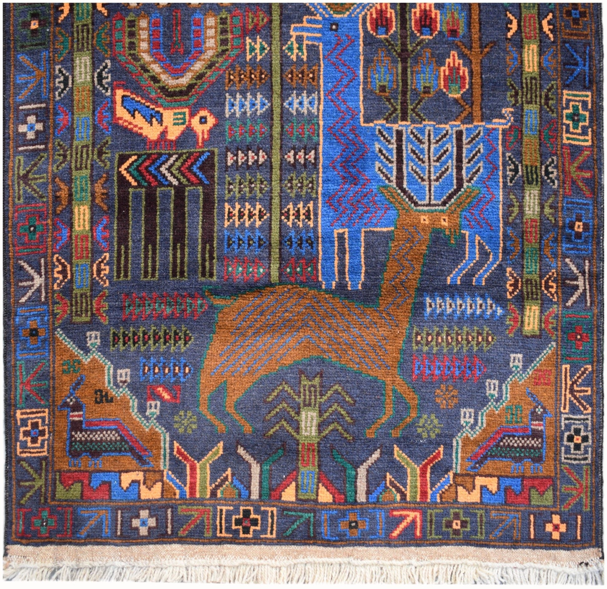 Handmade Afghan wool runner rug featuring a blue and brown hunting scene with animals and trees.