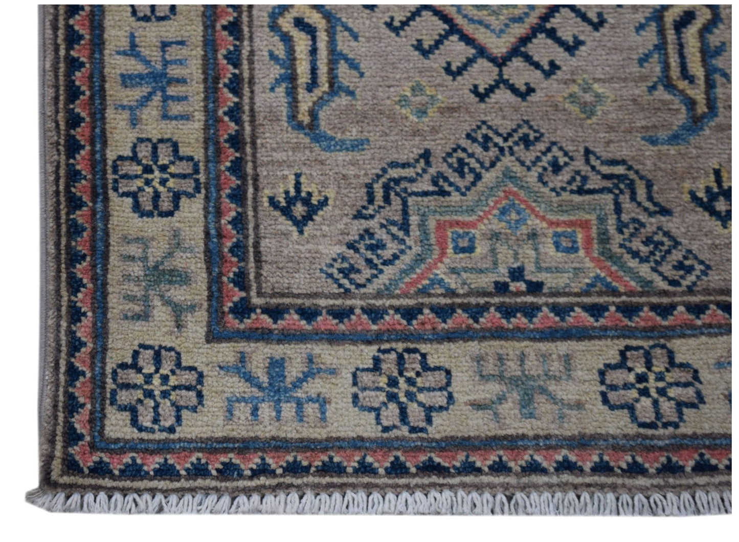 A handmade Afghan Kazakh runner featuring traditional geometric motifs in blue, red, and tan wool.