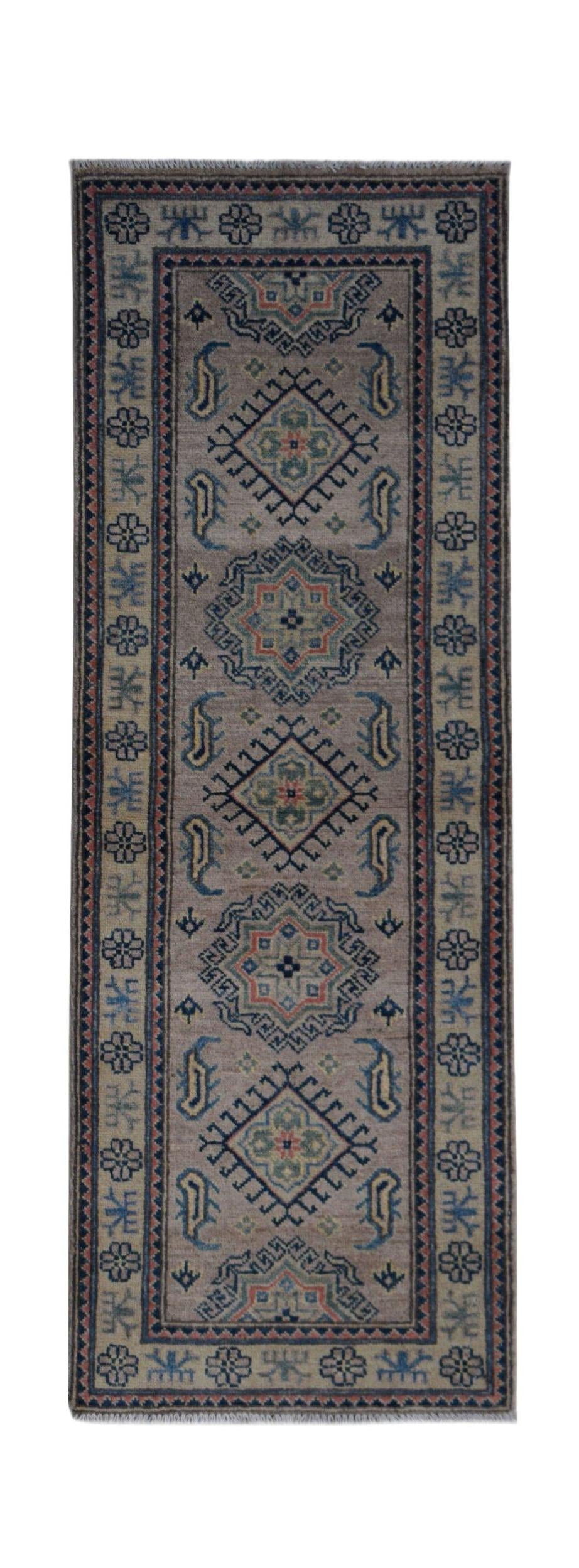 An Afghan Kazakh runner rug featuring traditional geometric motifs in blue, red, and green wool.