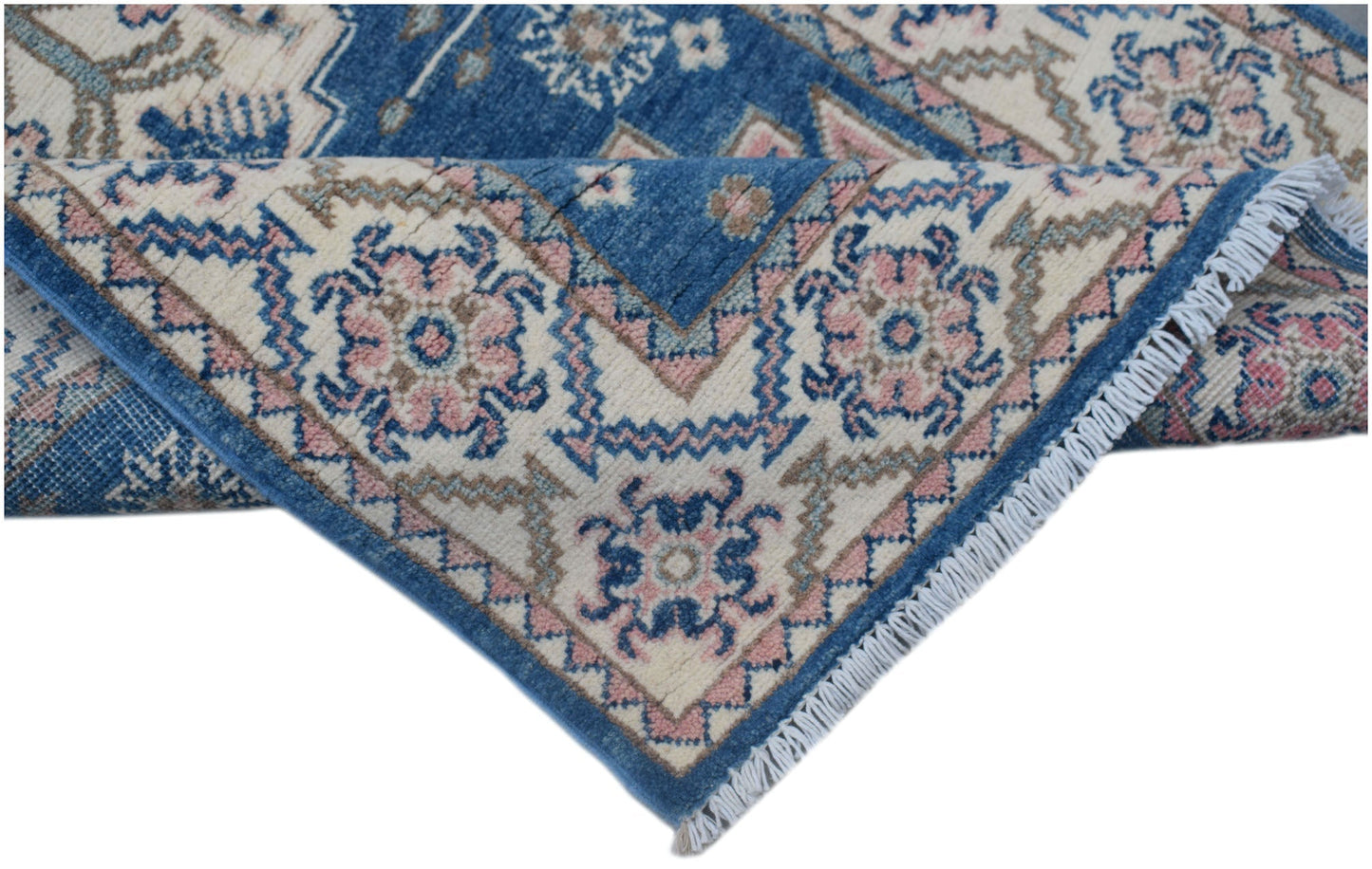 A handmade Afghan Kazakh runner featuring traditional blue, pink, and cream geometric patterns.