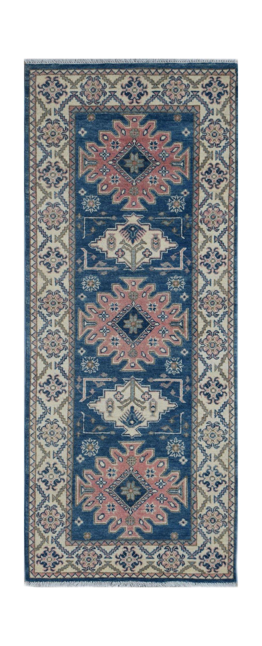 A handmade Afghan Kazakh runner rug featuring traditional geometric motifs in blue, pink, and cream.