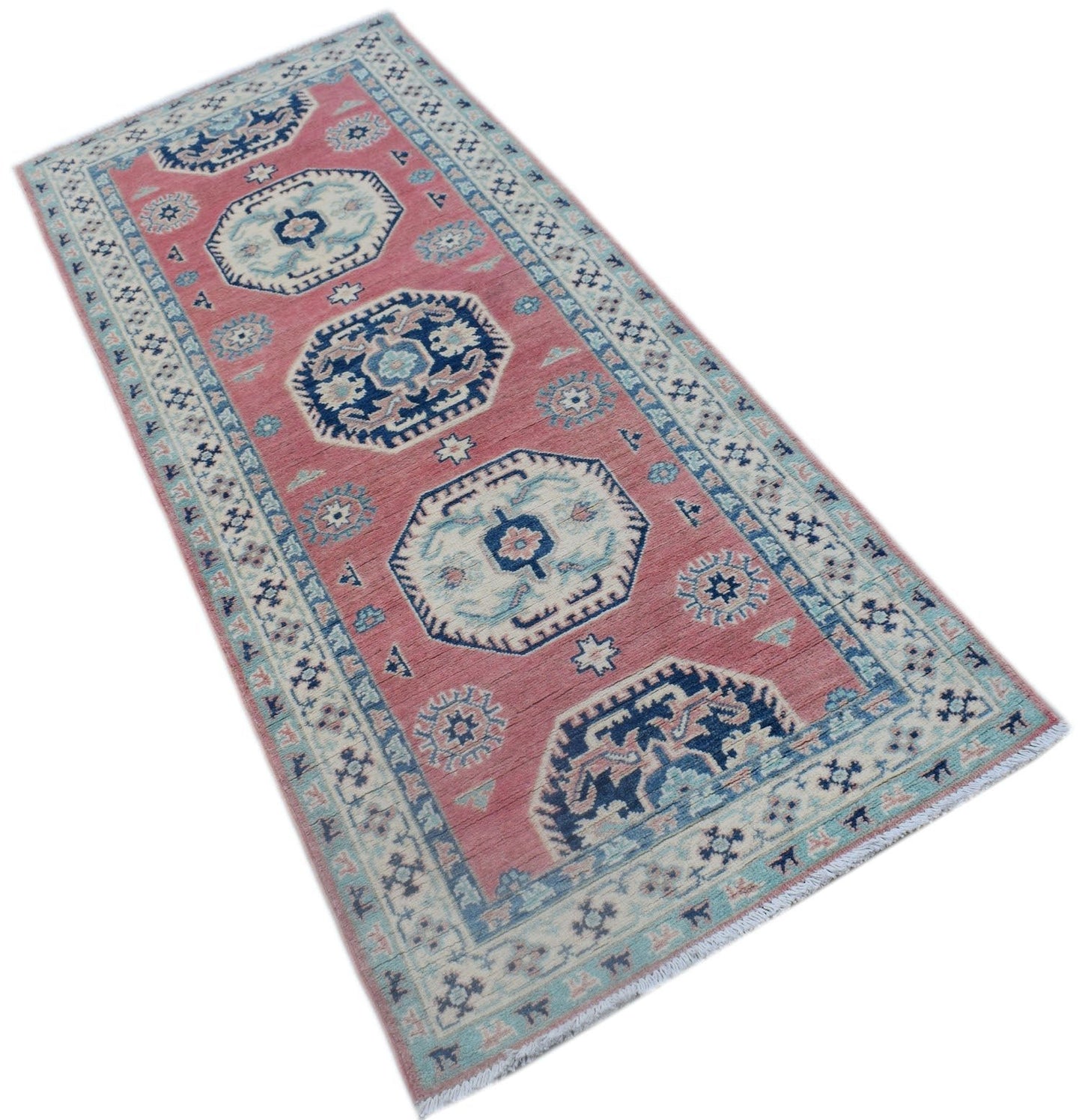 A handmade Afghan Kazakh runner rug featuring traditional geometric motifs in pink and blue tones.