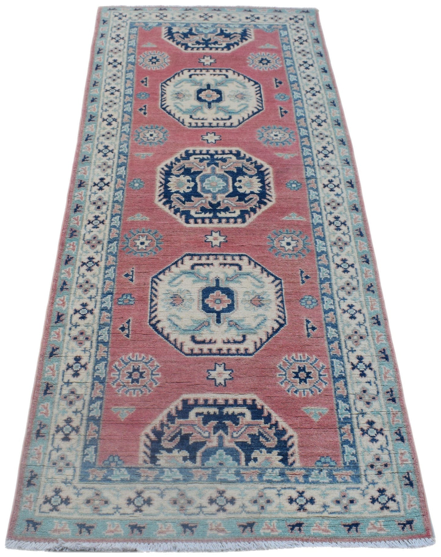 Handmade Afghan Kazakh runner rug featuring traditional geometric motifs in pink, blue, and cream.