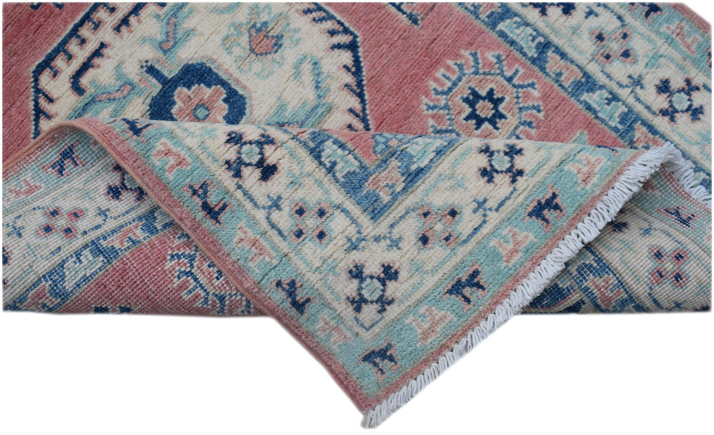 A handmade Afghan Kazakh runner featuring traditional geometric motifs in pink, blue, and cream.