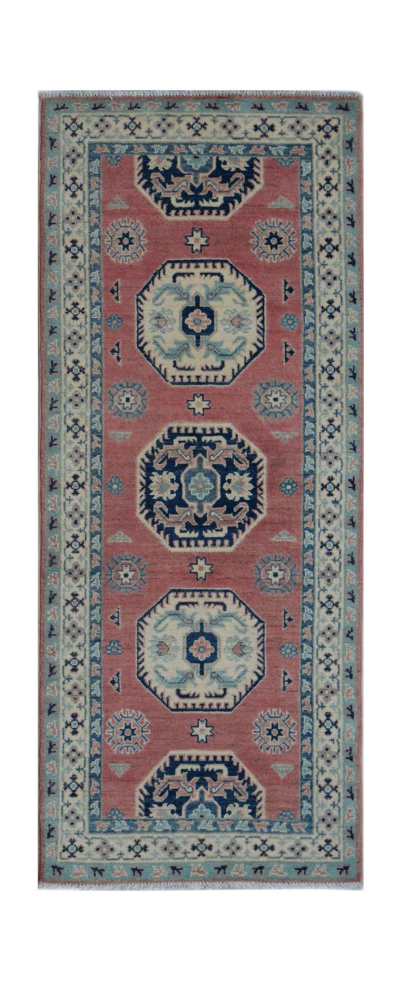 A handmade Afghan Kazakh runner rug featuring traditional geometric motifs in red and blue tones.
