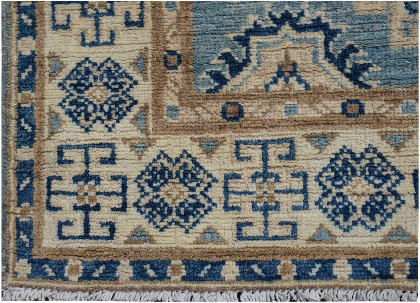 Handmade Afghan Kazakh runner featuring a geometric pattern in shades of blue, beige, and tan.