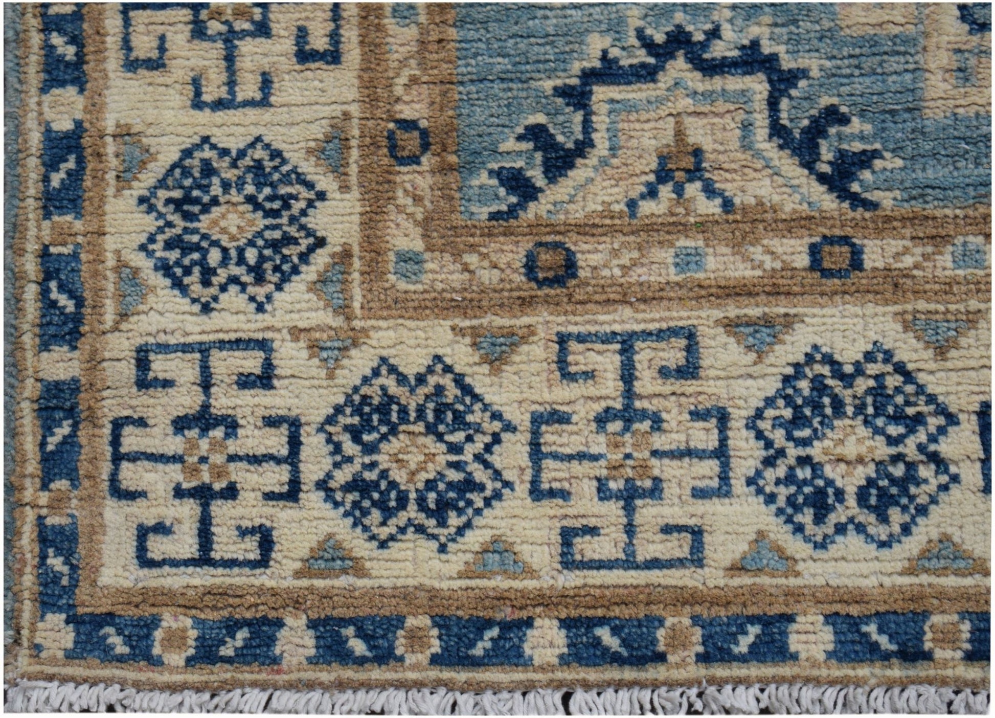Handmade Afghan Kazakh runner featuring a geometric pattern in shades of blue, beige, and tan.