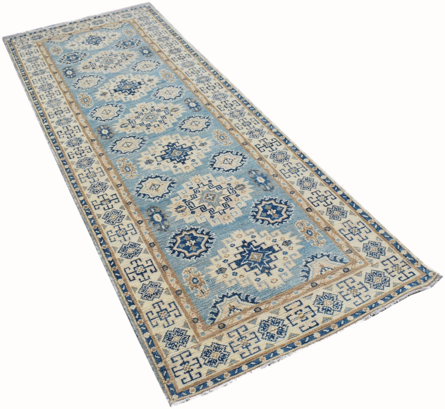 An Afghan Kazakh runner rug featuring a geometric pattern in shades of blue and beige.