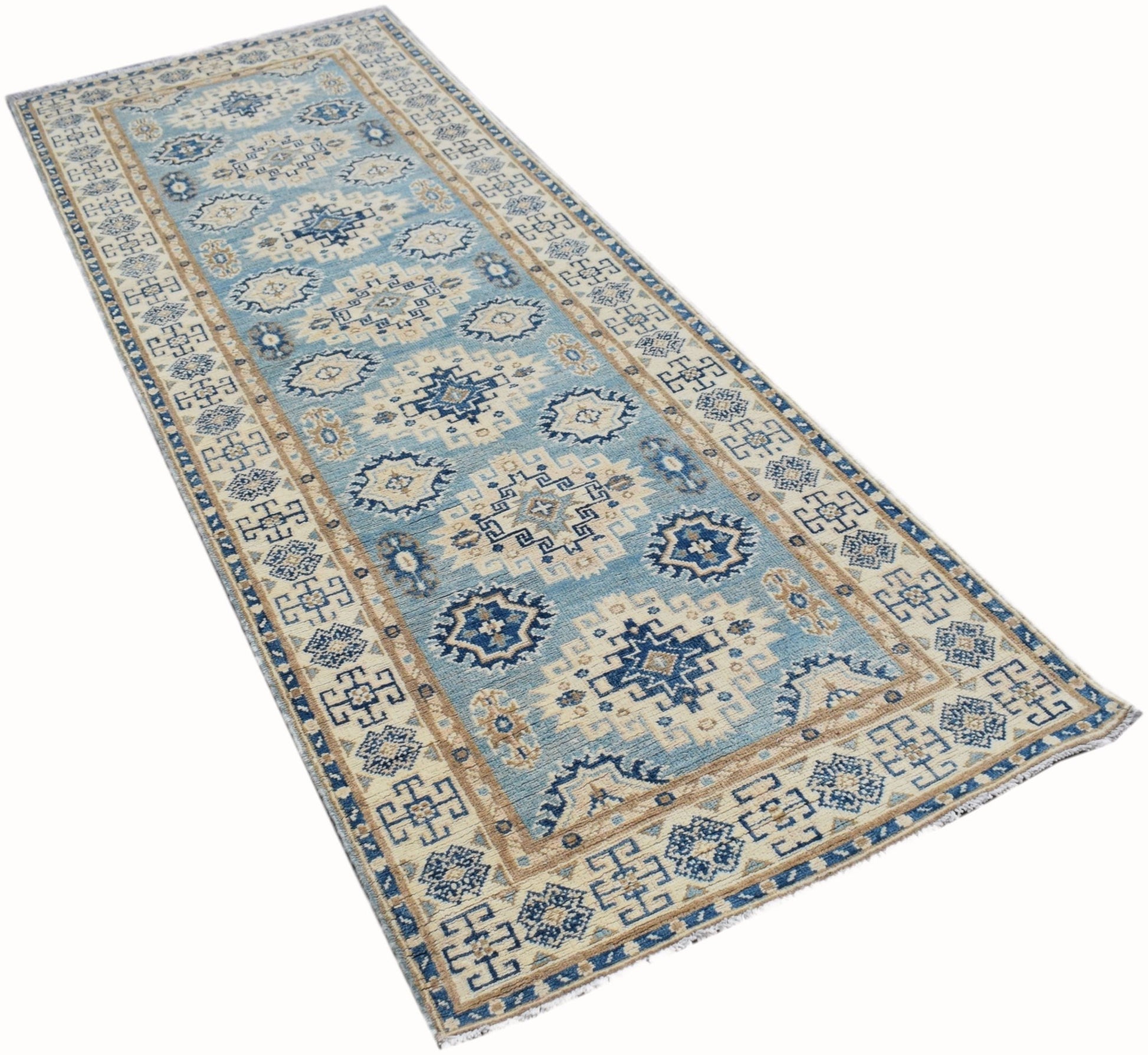 An Afghan Kazakh runner rug featuring a geometric pattern in shades of blue and beige.
