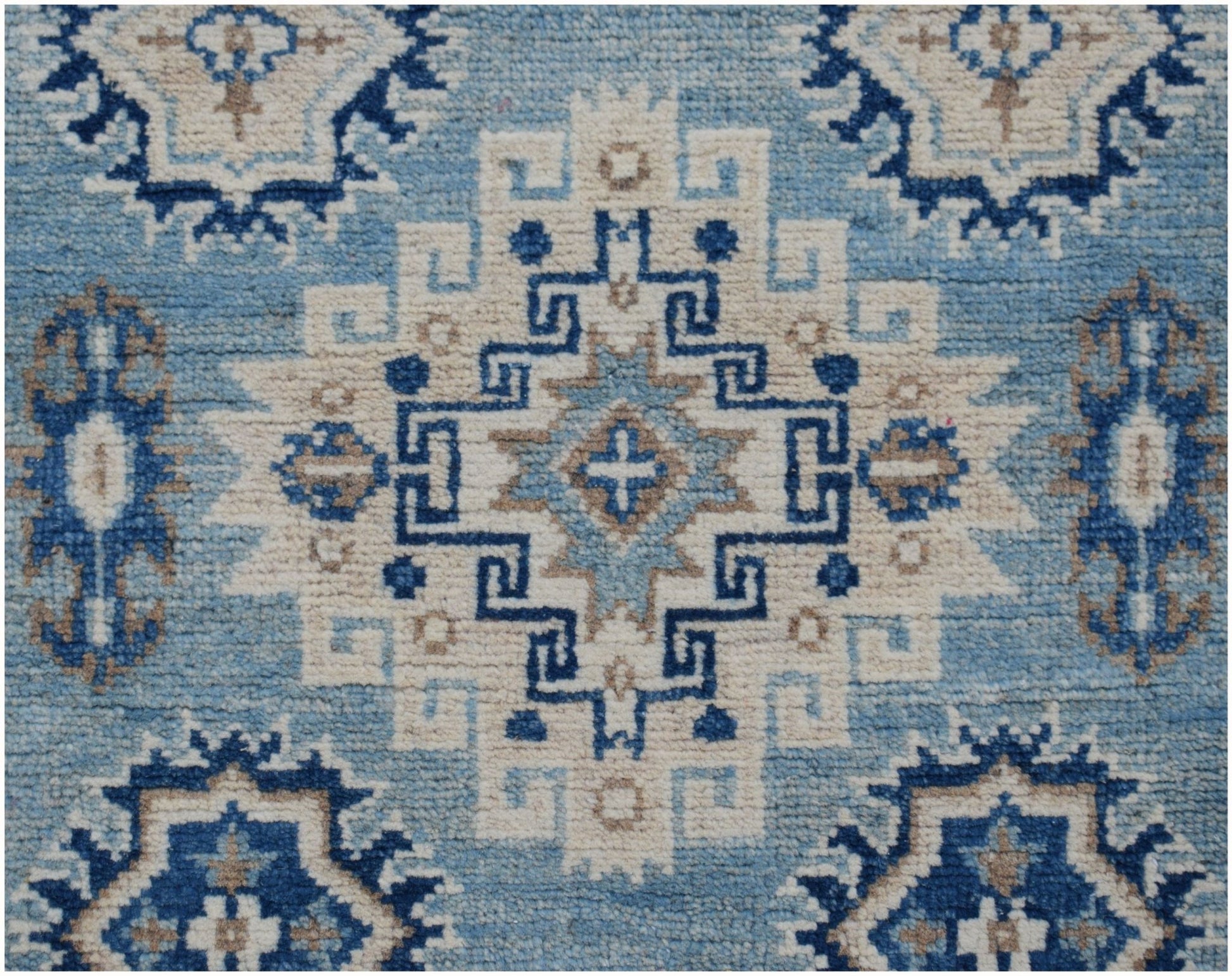 Handmade Afghan Kazakh runner rug featuring a geometric pattern in shades of blue, beige, and grey.