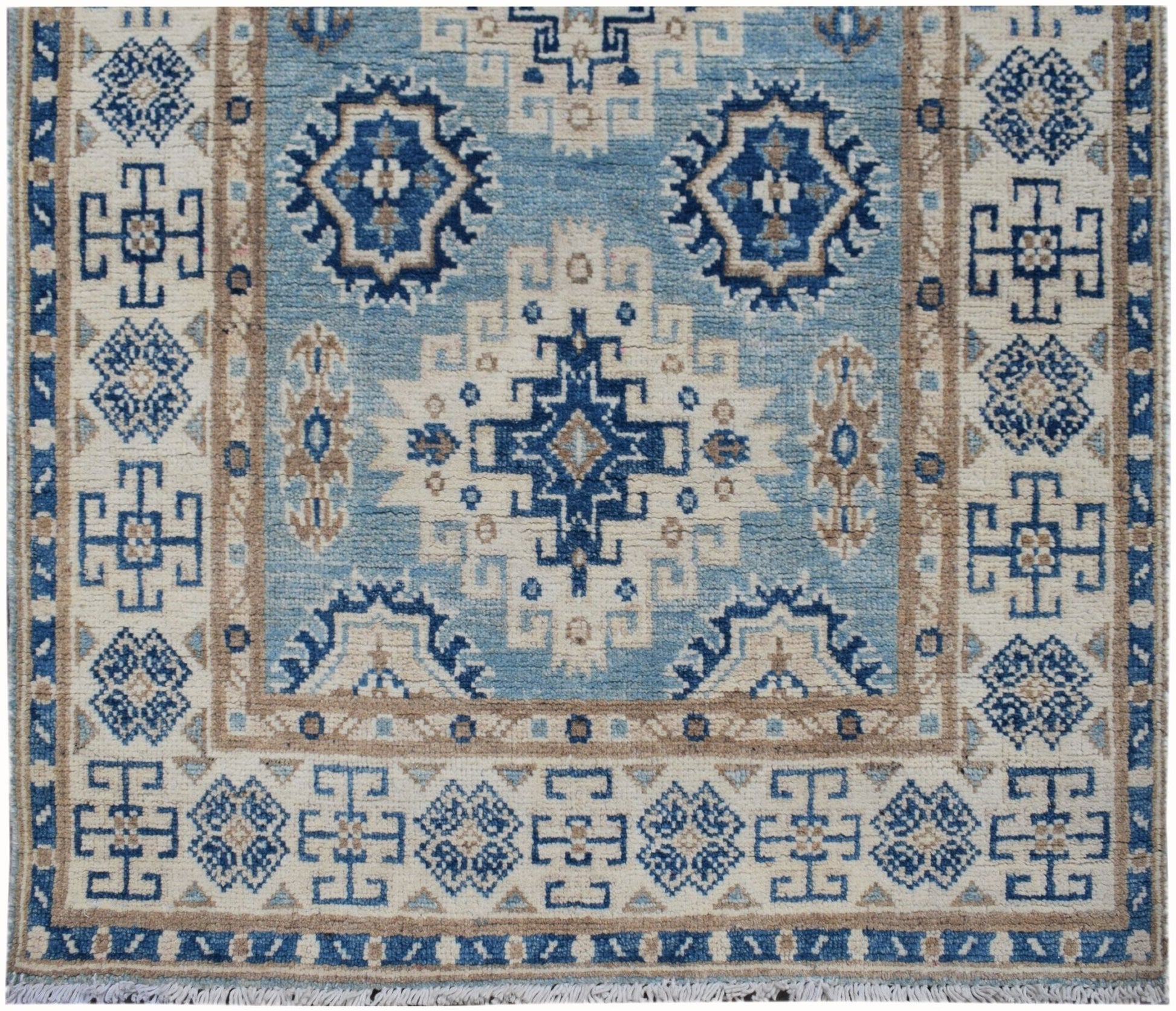Handmade Afghan Kazakh runner rug featuring geometric blue and beige tribal patterns.