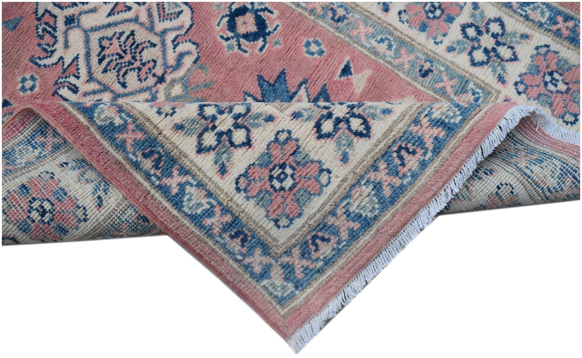 A handmade Afghan Kazakh runner featuring traditional floral motifs in pink, blue, and cream.