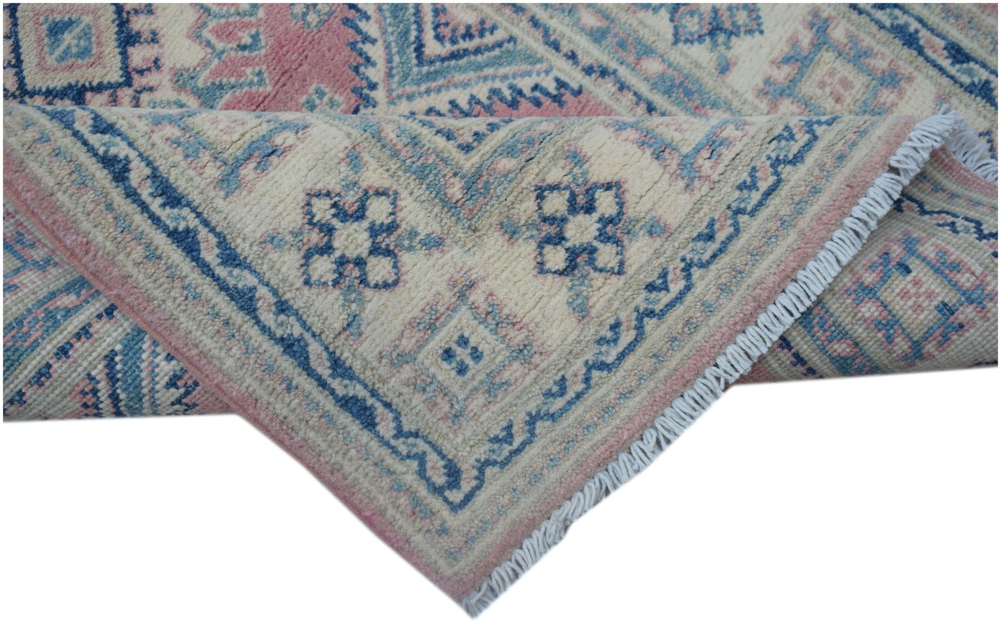 A handmade Afghan Kazakh runner featuring traditional geometric motifs in blue, pink, and cream.