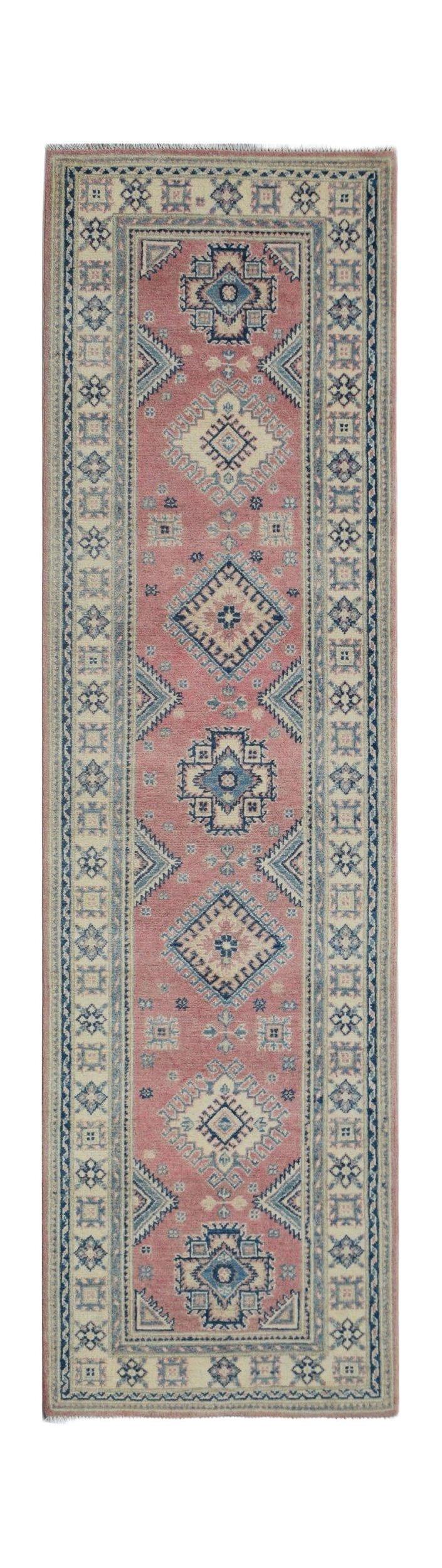Handmade Afghan Kazakh runner rug featuring traditional geometric motifs in pink and blue.