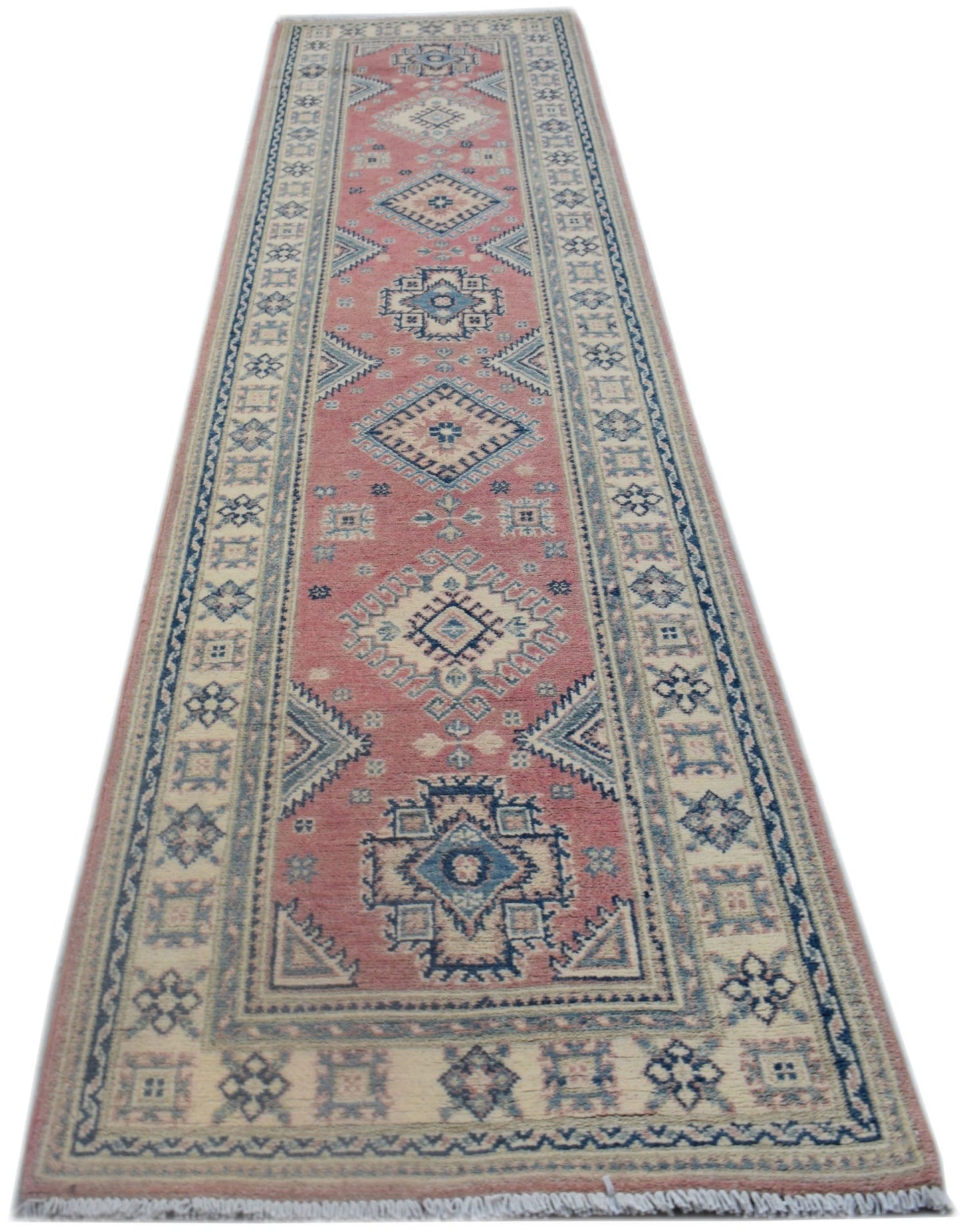 A handmade Afghan Kazakh runner rug featuring traditional geometric motifs in pink, blue, and cream.