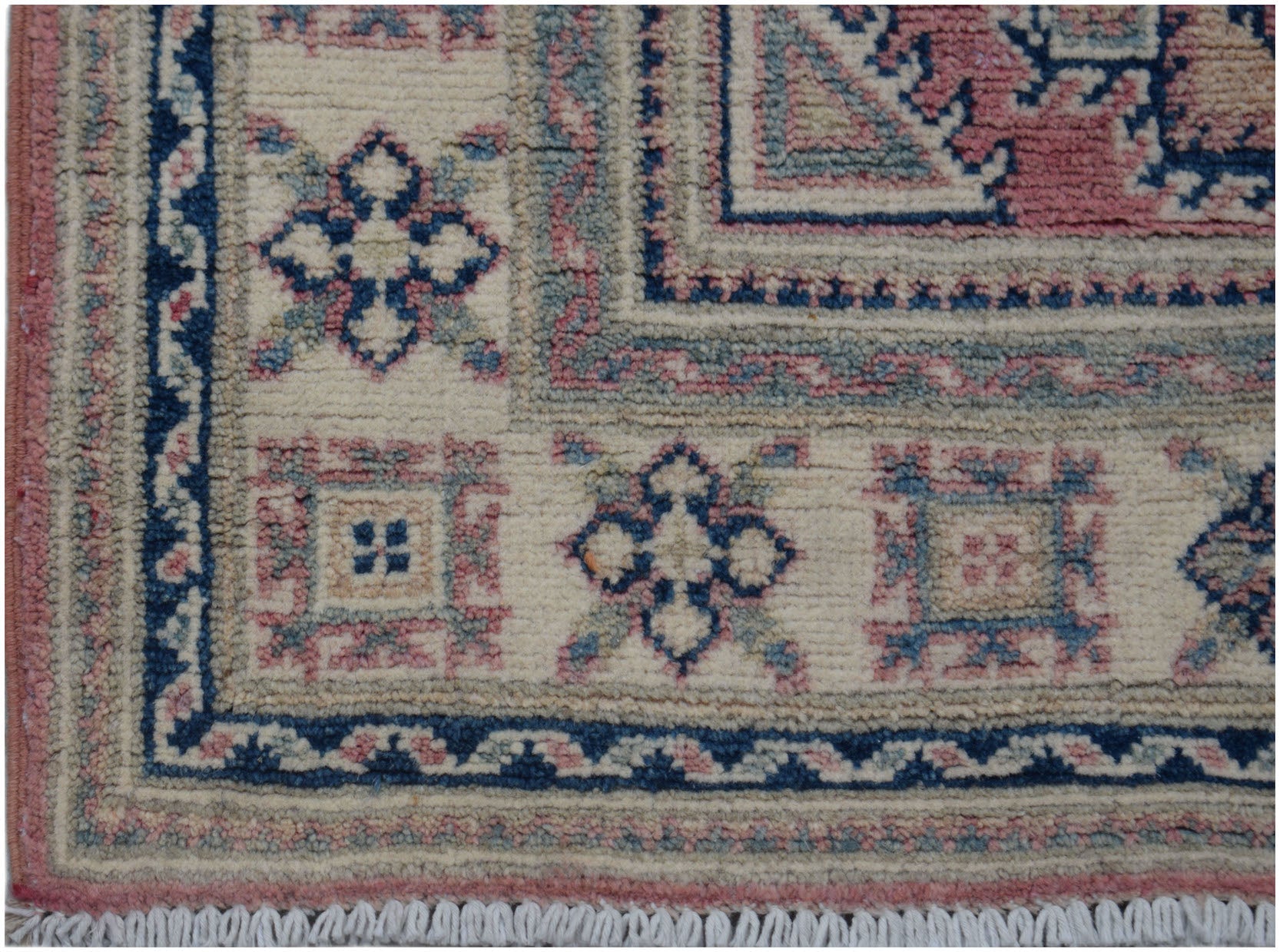 Handmade Afghan Kazakh runner featuring traditional geometric motifs in blue, pink, and cream.