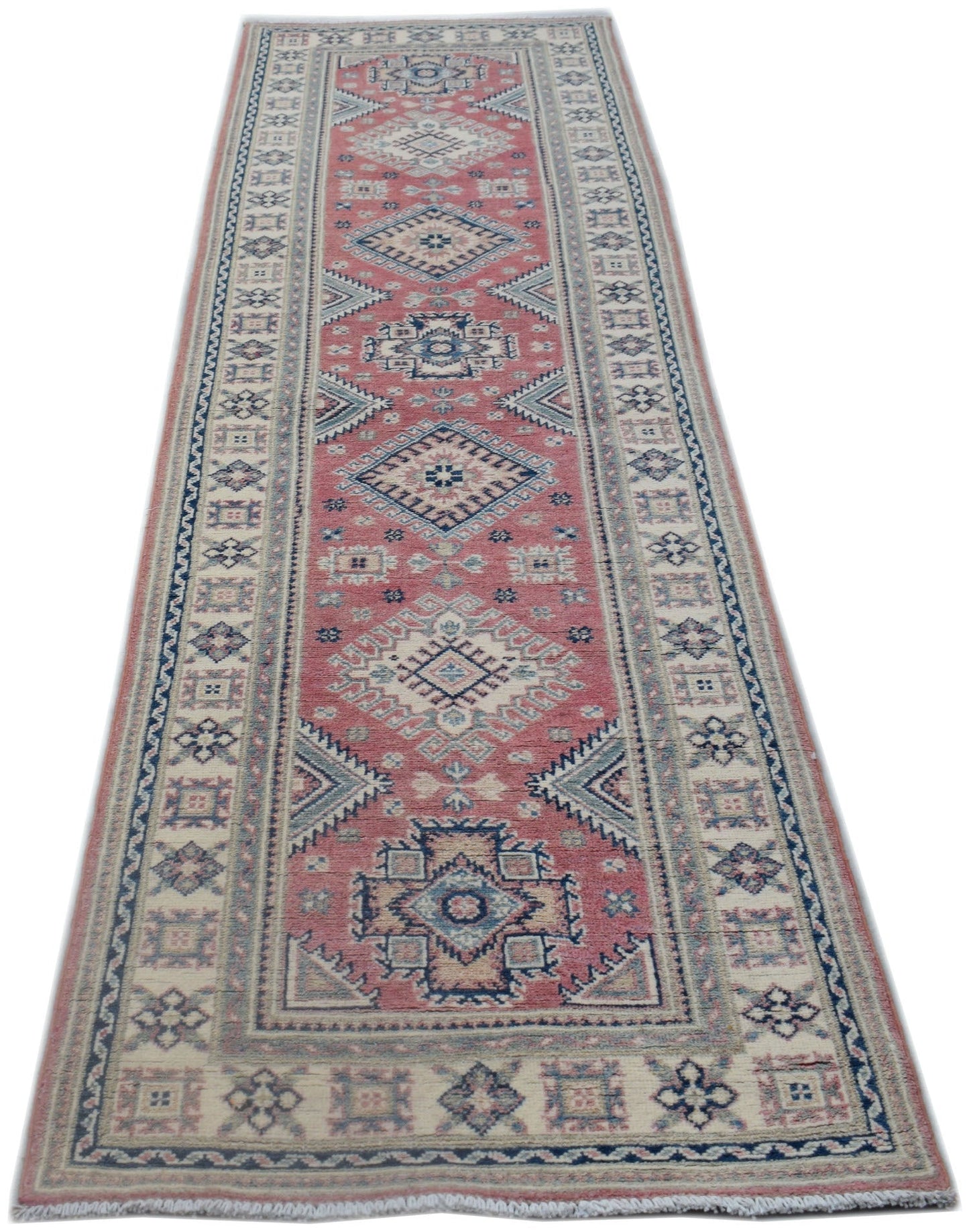 A handmade Afghan Kazakh runner rug featuring traditional geometric motifs in red, blue, and cream.
