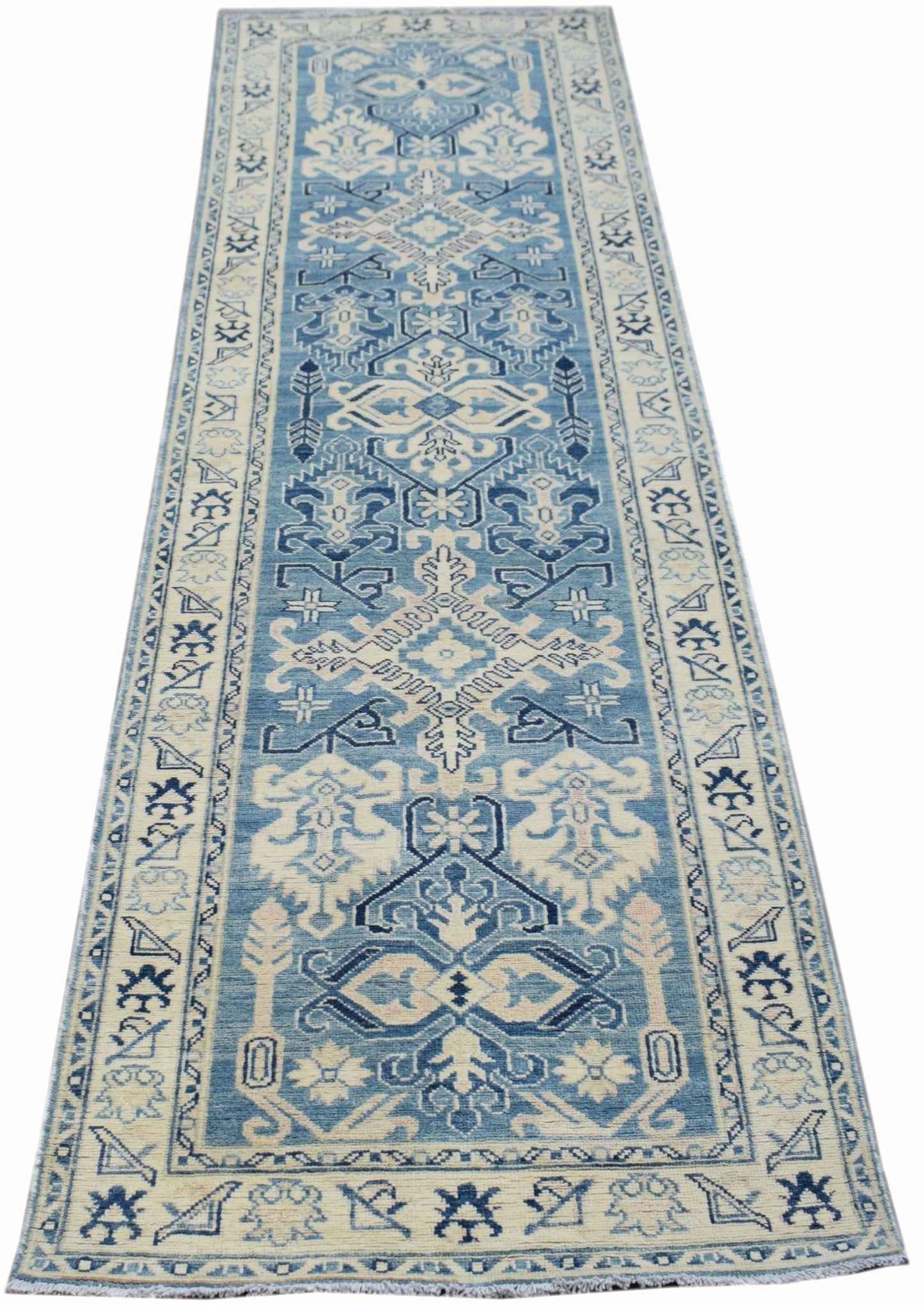 Handmade Afghan Kazakh runner rug featuring a traditional geometric pattern in blue and beige.
